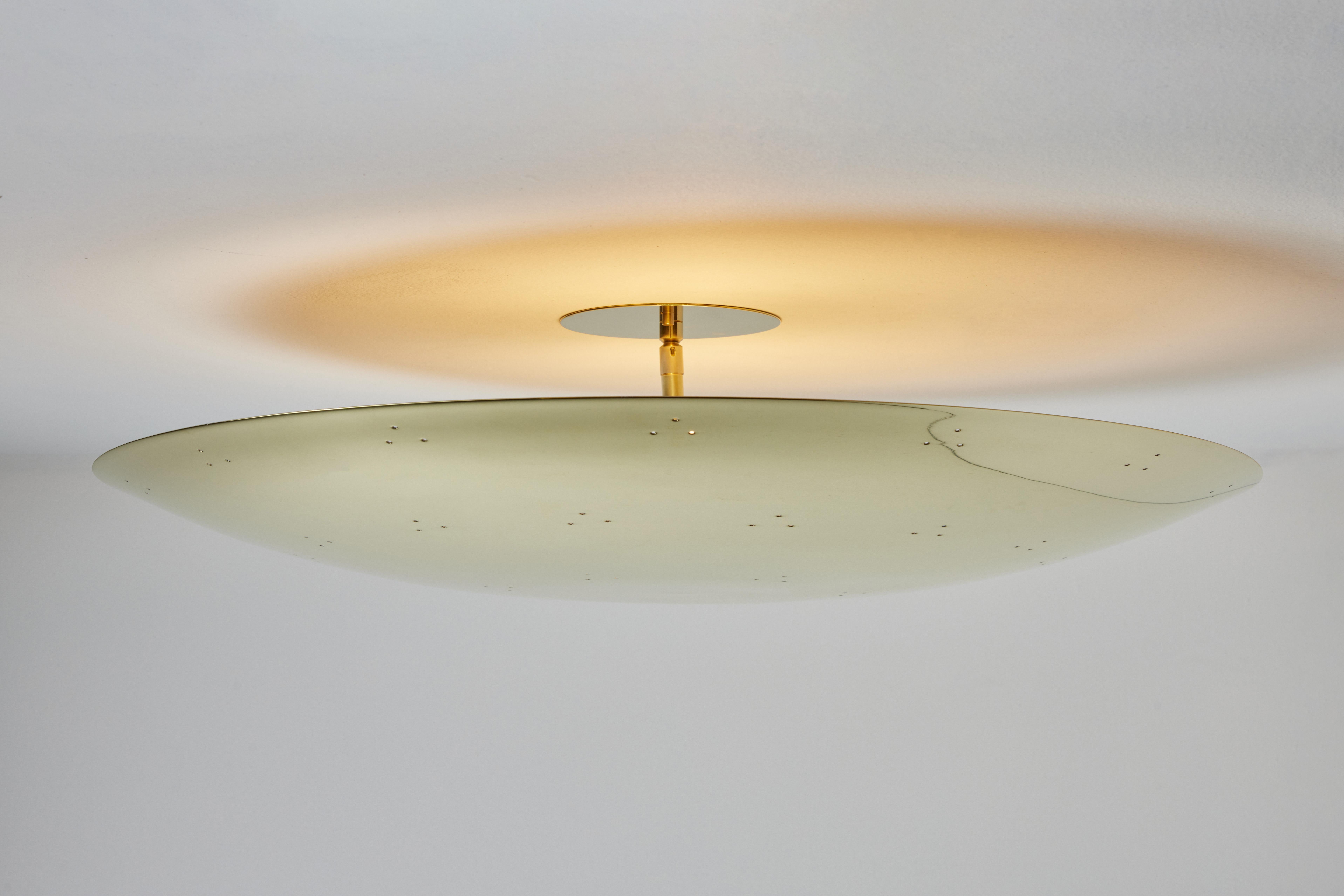Large Two Enlighten 'Rey' Perforated Polished Brass Dome Ceiling Lamp. Hand-fabricated in Los Angeles, these highly refined ceiling lamps are reminiscent of the iconic midcentury Finnish designs of Paavo Tynell and Lisa Johansson Pape. Executed in
