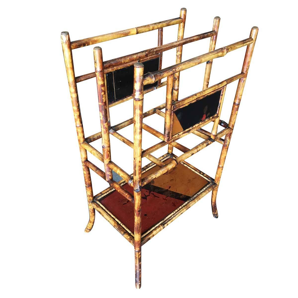 Large two-tier antique tiger bamboo magazine rack with divider and bottom shelf for larger books. Decorative hand-painted tri-colored triangle and second shelf help bring some color to this piece. 

Restored to new for you.

All rattan, bamboo and