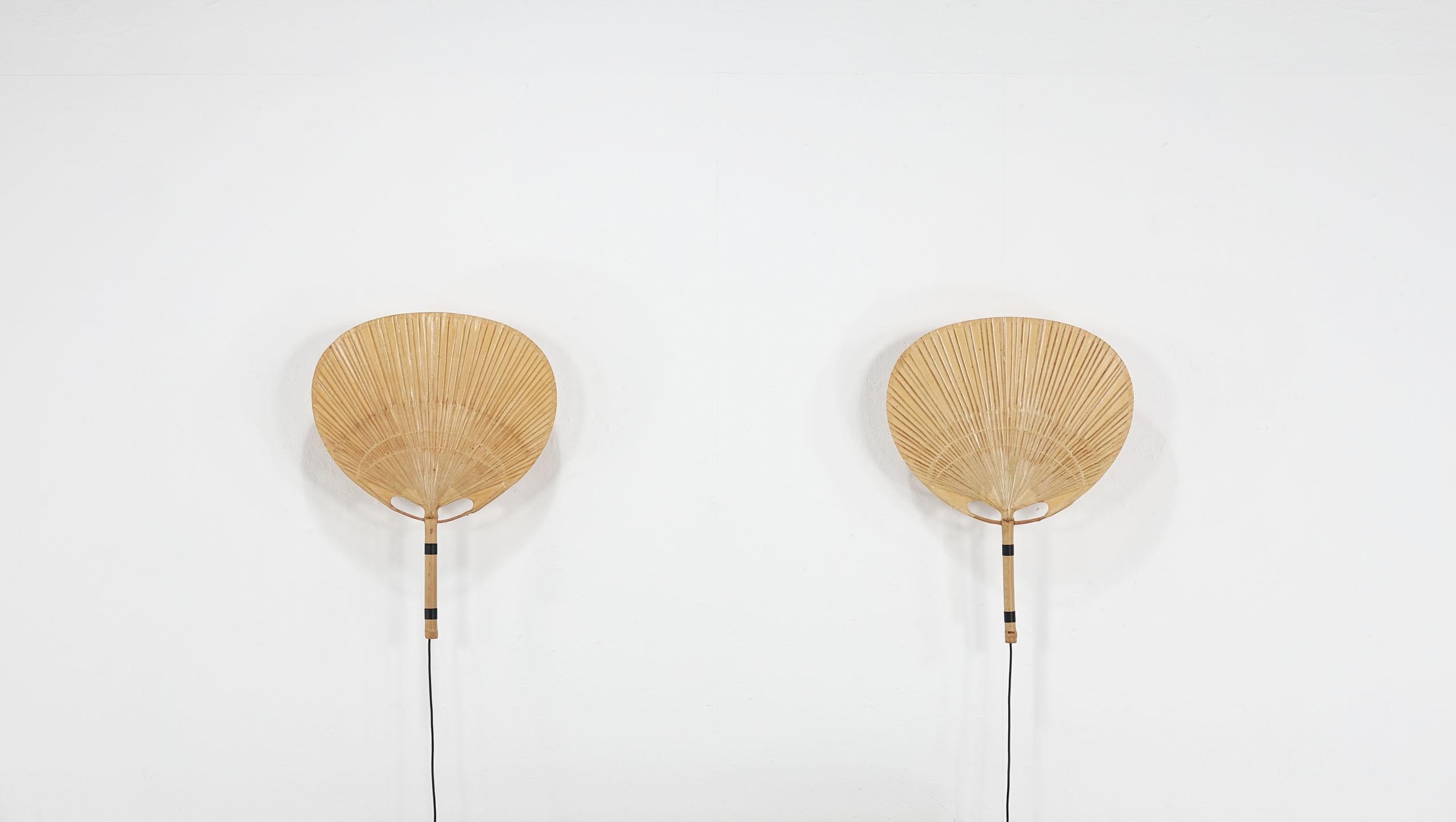 Beautiful big vintage ‘Uchiwa’ wall lights with metal holder for wall hanging, designed by Ingo Maurer, Germany, 1973. The light is made of bamboo and Japanese rice paper. The lamps are in an original beautiful condition.
  