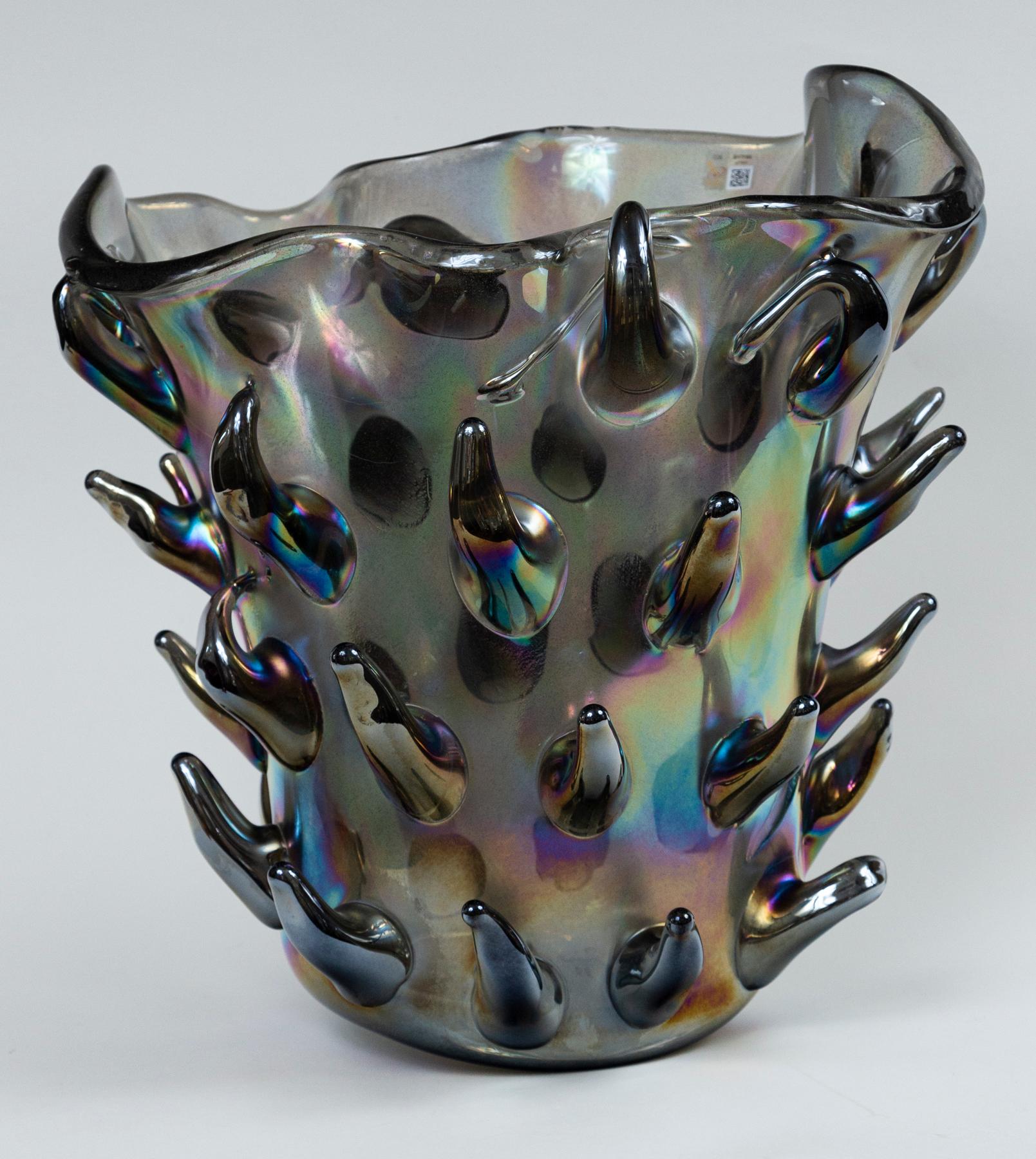Fabulous large organic shaped oval vase with cacti  shapes in a dark grey and black iridescent colors

Signed by the artist

Origin: Murano, Italy

Dating: Contemporary

Condition: Excellent

Dimensions: 15.5″ wide, 11″ deep, 16.5″ high