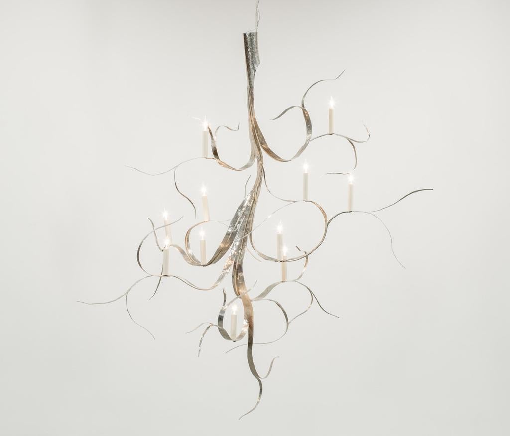 Sculpture / chandelier with 11 lights hand twisted and hammered from one piece of aluminum.