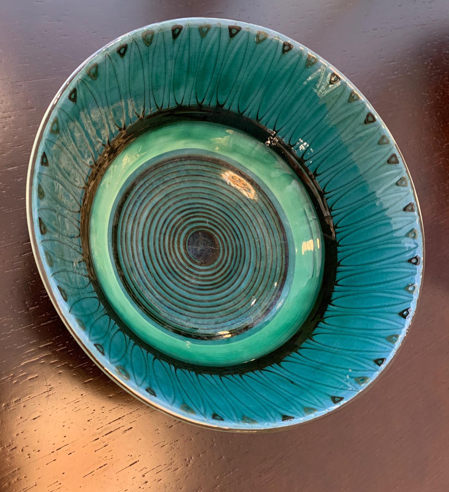 Large vintage Danish 1940s decorative hand painted art pottery bowl with a unique glaze by Herman H.C. Kähler (1876-1940). Kähler is a renown Danish ceramic factory established in 1839. 

The tall black 'slip applied' glazed bowl stands on a round