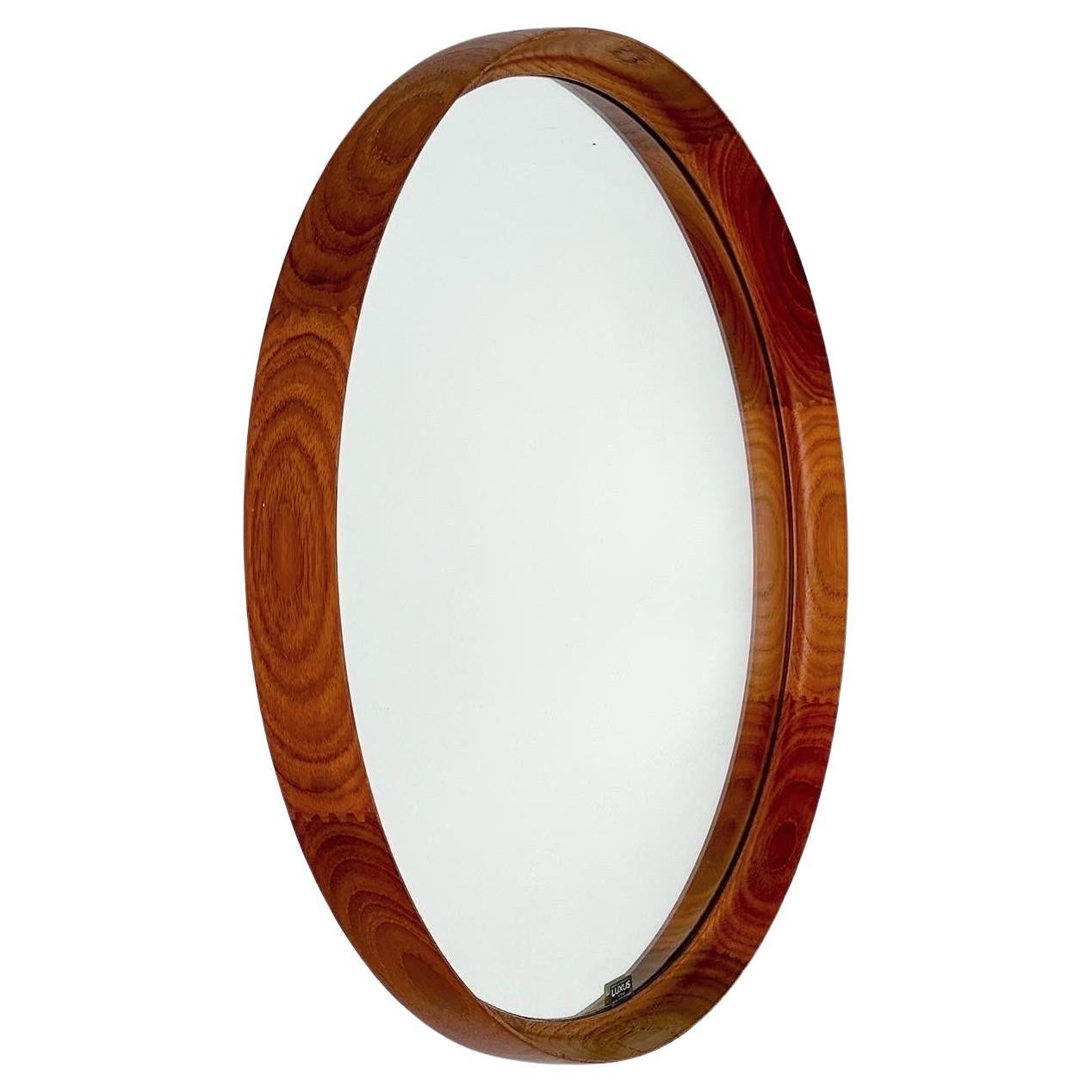 Large mirror by Swedish designer duo Uno & Östen Kristiansson for Luxus in Vittsjö, Sweden, 1960s.

Beautiful grained solid teak frame, contrasting zig zag joints. Comes with the original mirror glass in good condition. Remains the original