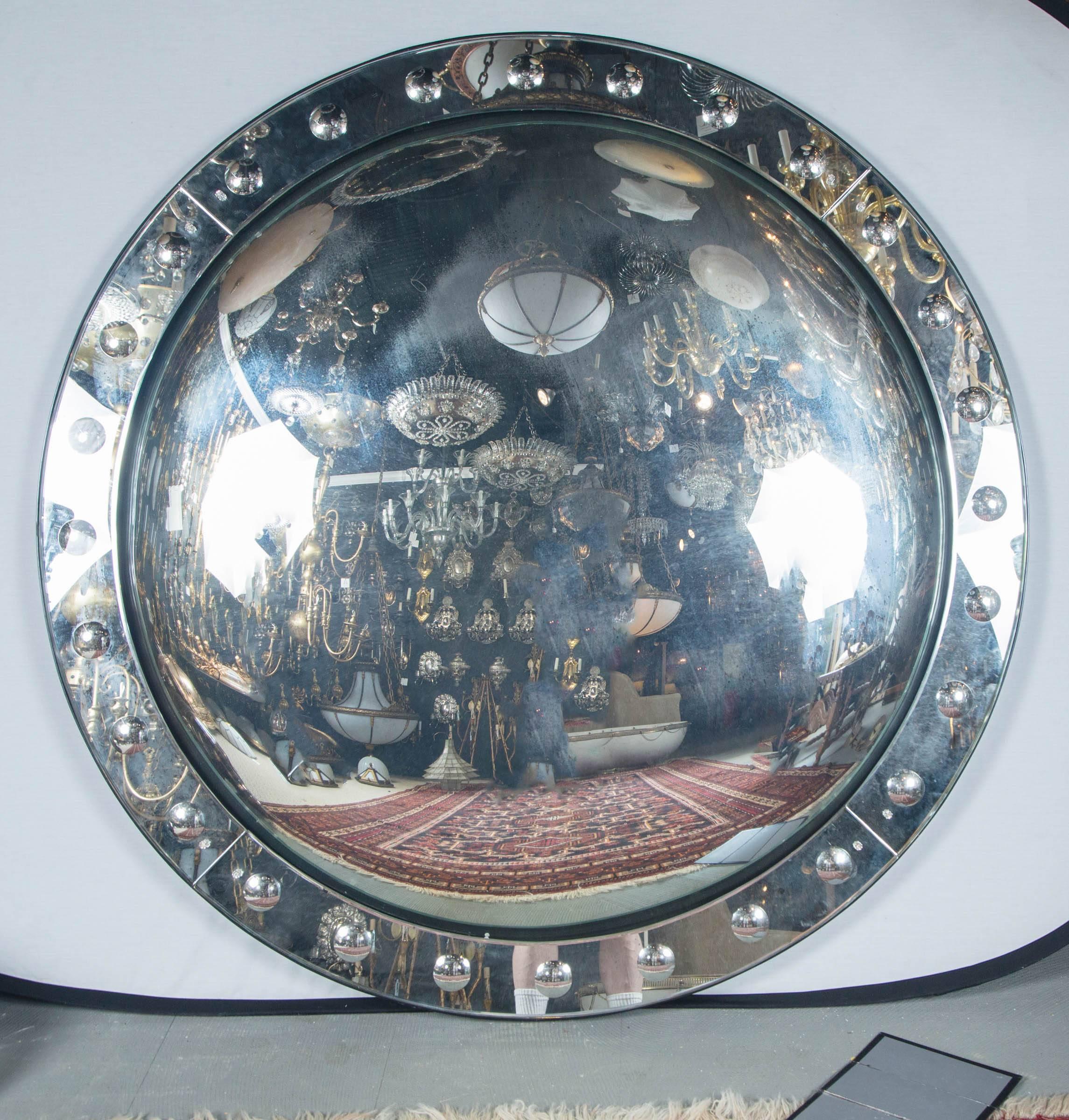 A large unusual circa 1960s English edged and convex mirror.
