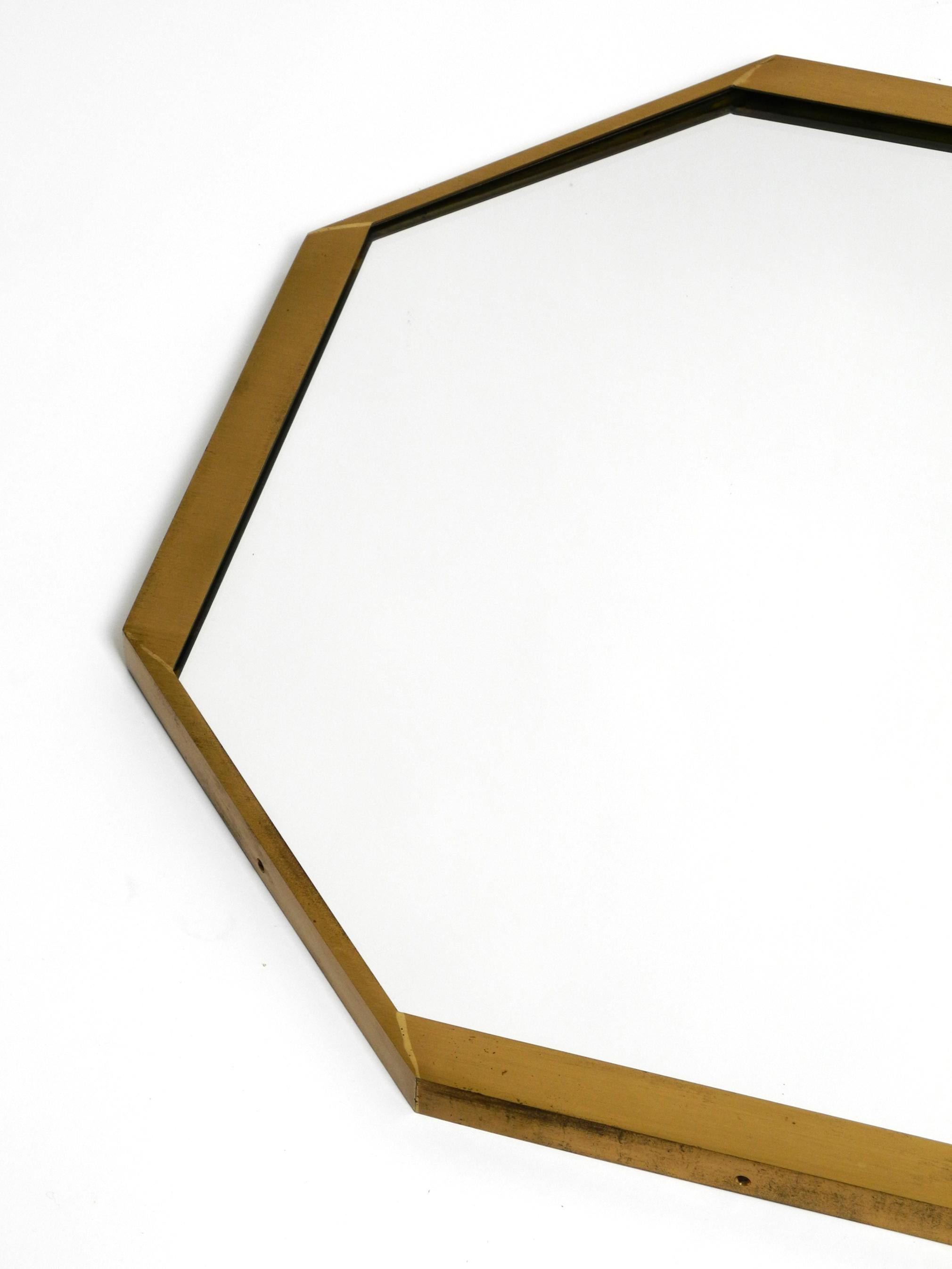 Large unusual Italian Mid Century Modern octagonal brass wall mirror  In Good Condition For Sale In München, DE