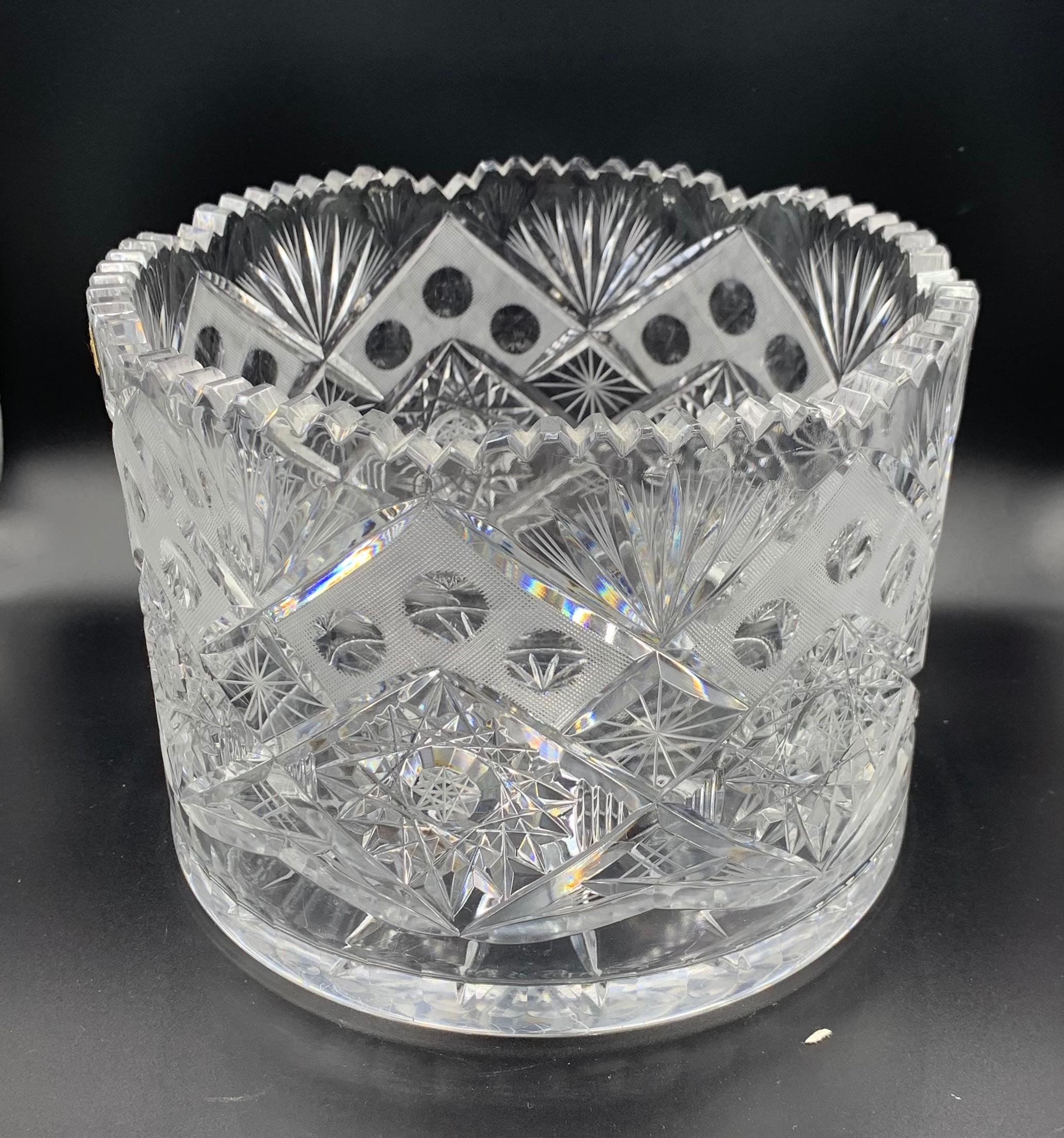 Gorgeous large heavy hand made crystal ice bucket / champaign wine cooler made in Czechoslovakia. This piece could also be used as a planter or as a bowl. The original gold tag is on the piece, but the tag is in worn condition.