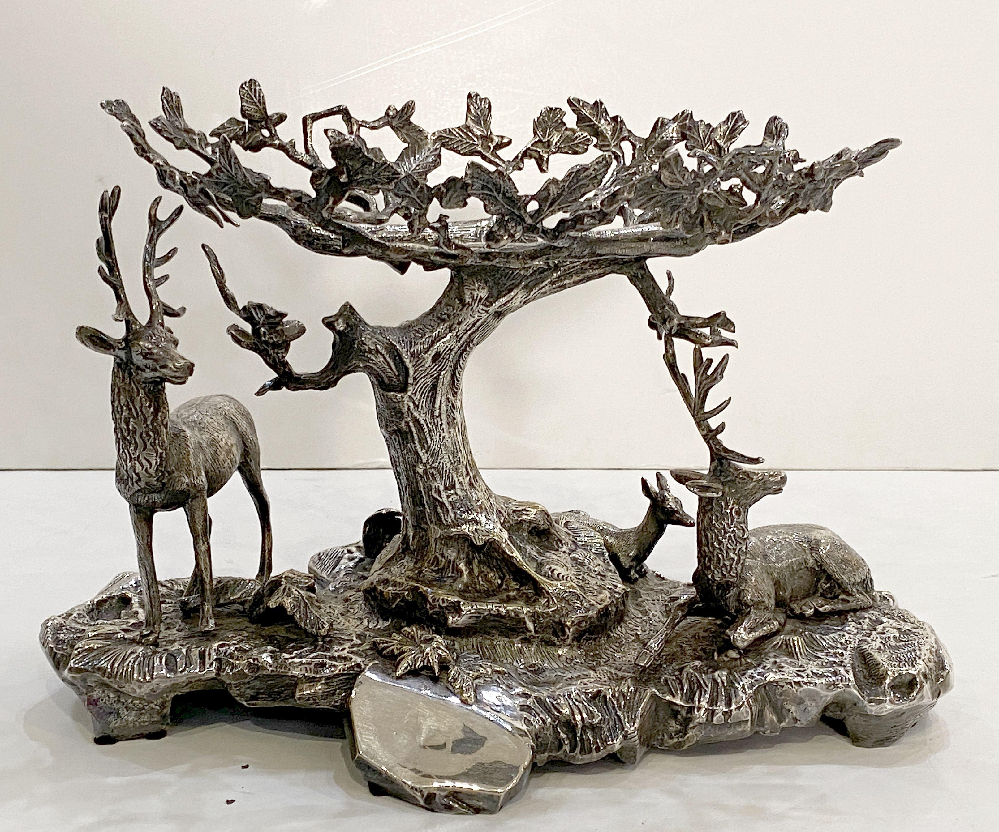 Valenti Sculptural Centerpiece of Stag and Deer of Silver Plated Bronze

A beautiful centerpiece figural sculpture of stag and deer resting under the boughs of an oak tree in fine plate silver over bronze, by the renowned Spanish design house,