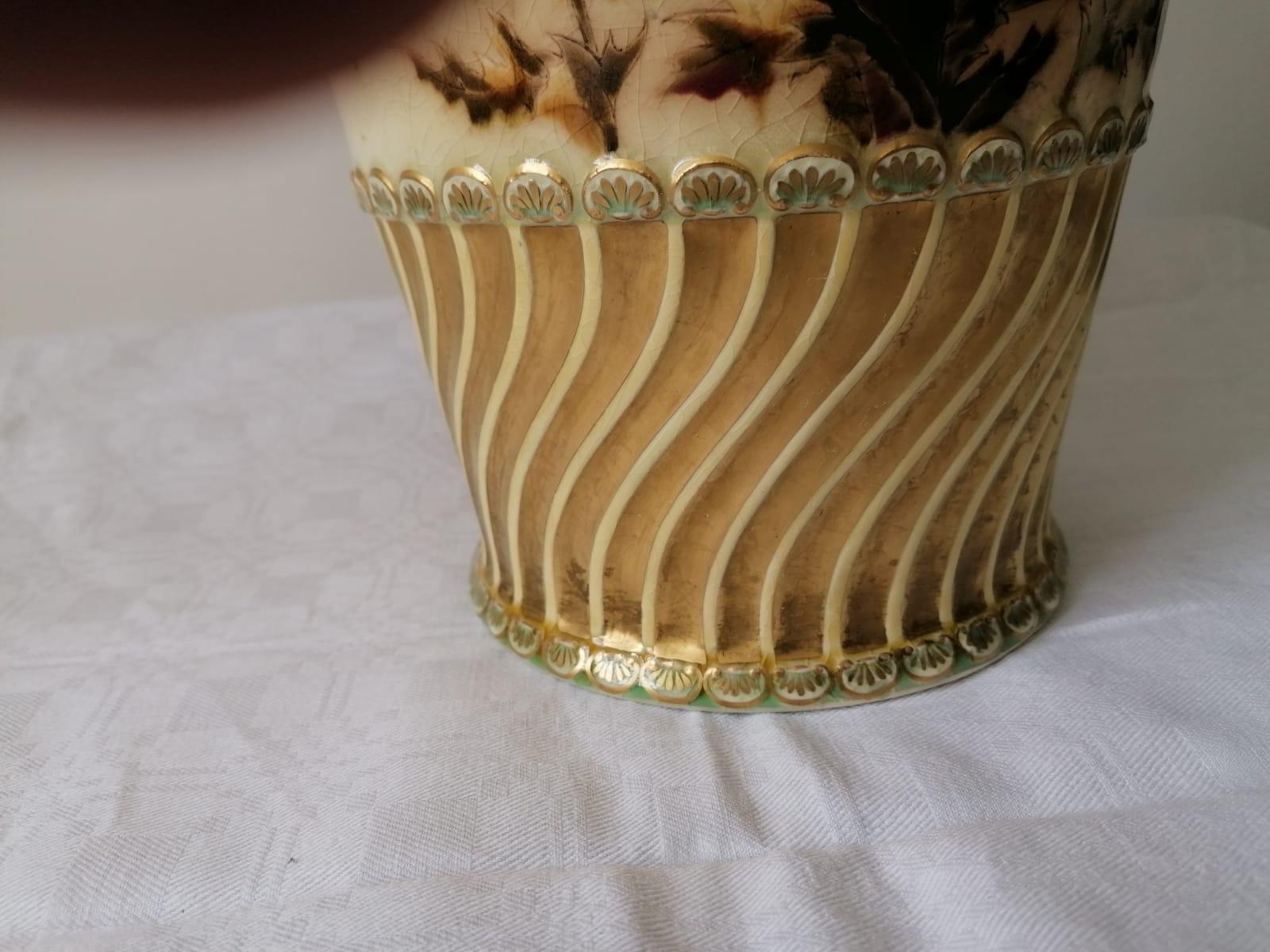 Porcelain faience, partially double-walled openwork, floral decoration painted in color and gold, height 60 cm, mark with MEK, gold edge somewhat rubbed. Made in Hungary by Zsolnay, circa 1880.