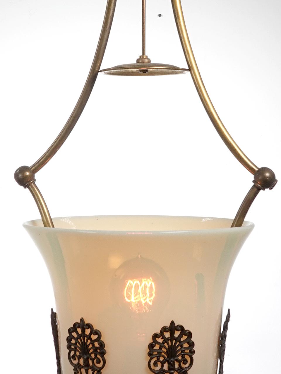 This was an early gas lamp that we carefully converted to electric.
The Vaseline glass shade is one of the largest we have offered. You just don't see many large Vaseline examples. The lamp is very vertical and nice for stairways are high ceilings.