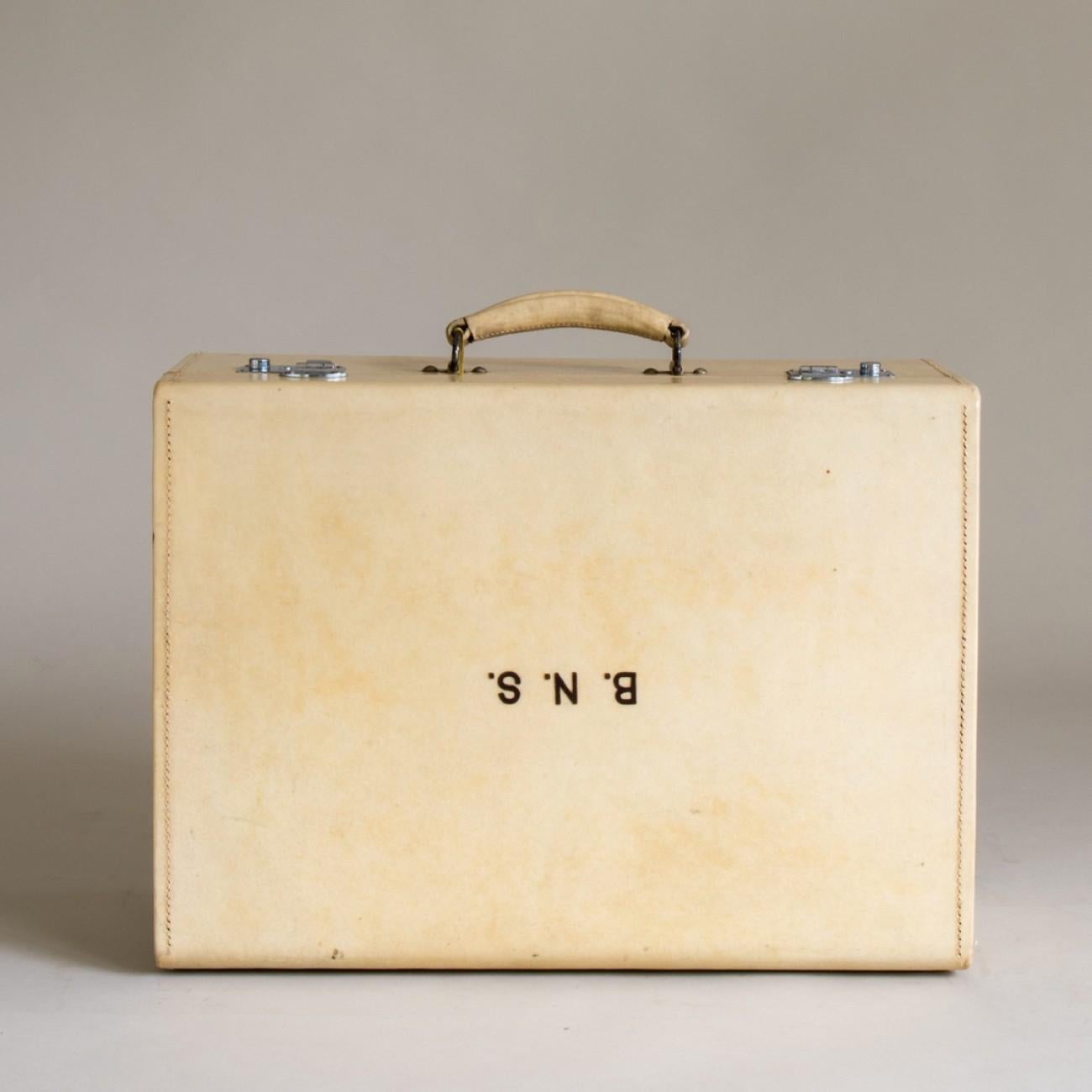 An excellent example of a suitcase made of vellum with nickel plated fittings, original key and original silk lining. Also has embossed initials B.N.S. Circa 1920.

Dimensions: 21cm/8¼ inches (height) x 73.5cm/29 inches (width) x 39.5cm/15½