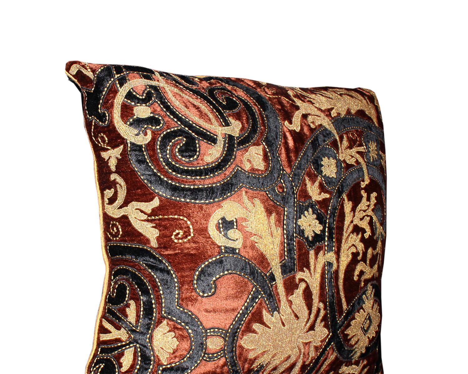 Embroidered pillow with rust, gold and black velvet.

Measures: 24