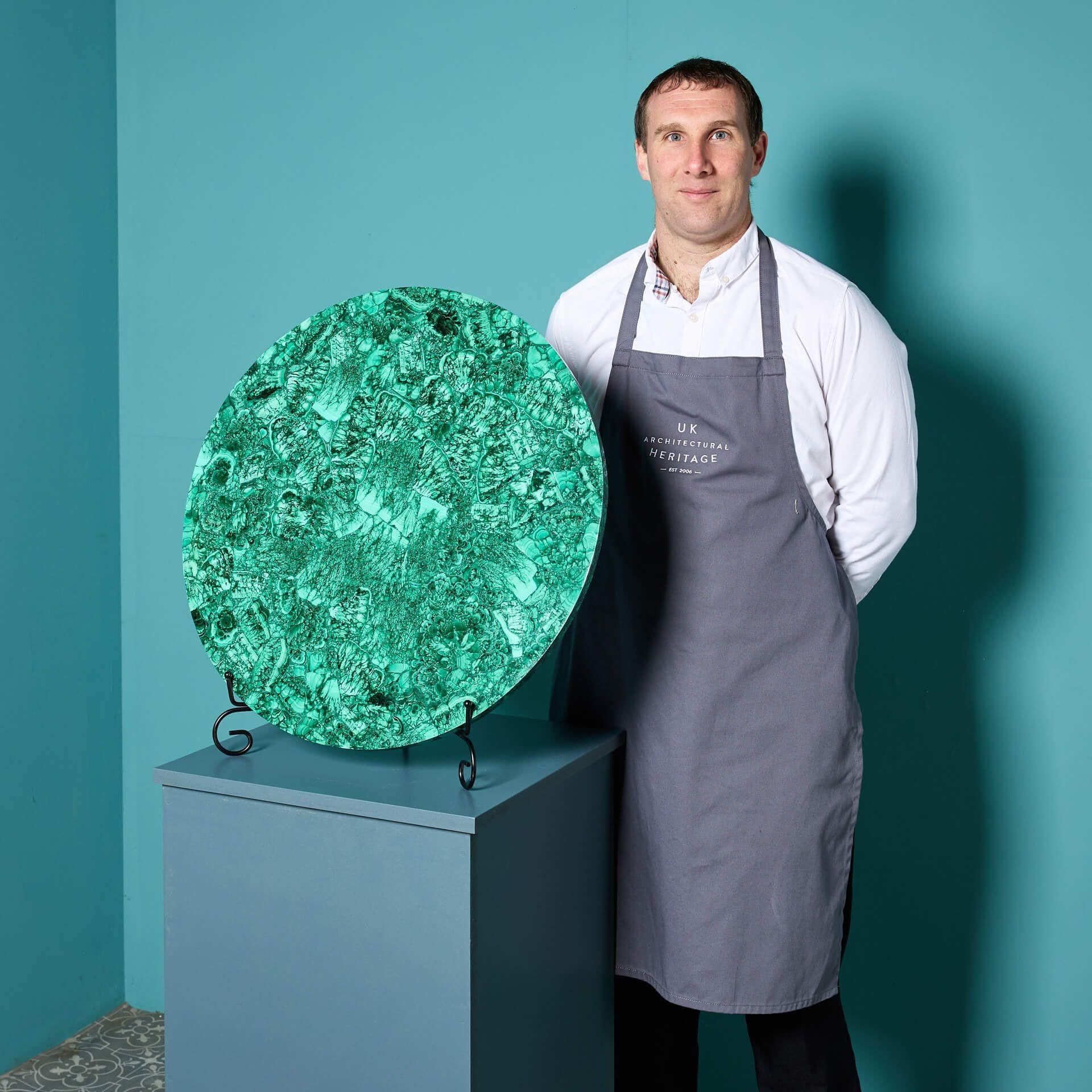 A large veneered malachite table top dating to the late 20th century.

Originating from North Africa, this is a striking piece depicting the exceptional vibrant mineral over a base of onyx.

Malachite has a striking form that has been moulded by