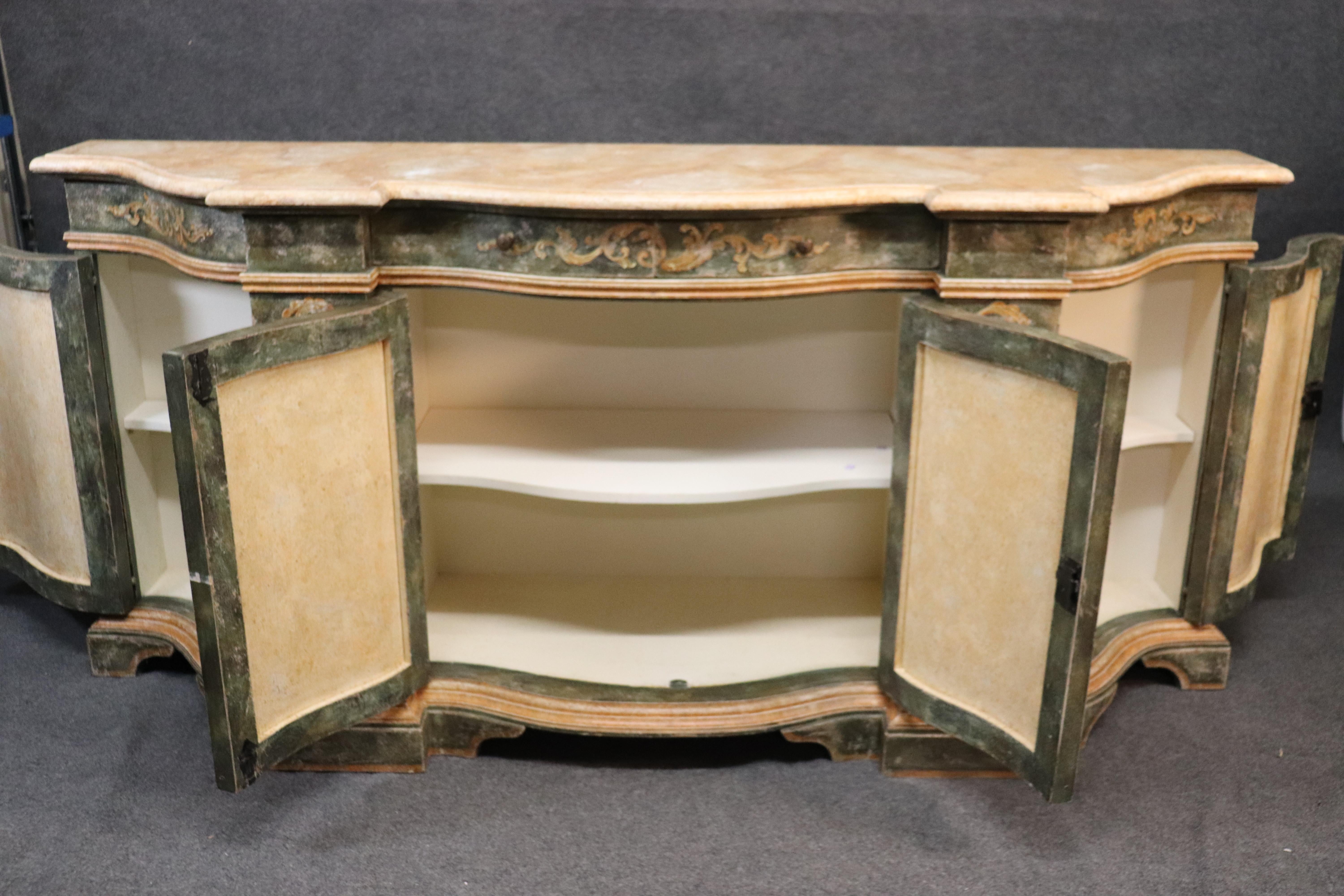 This is a fantastic custom made Italian Venetian sideboard. This was made in Italy and handmade and hand painted to replicate an authentic antique. If I didn't tell you, you'd think it was 150-200 years old, it's that well-made. The sideboard