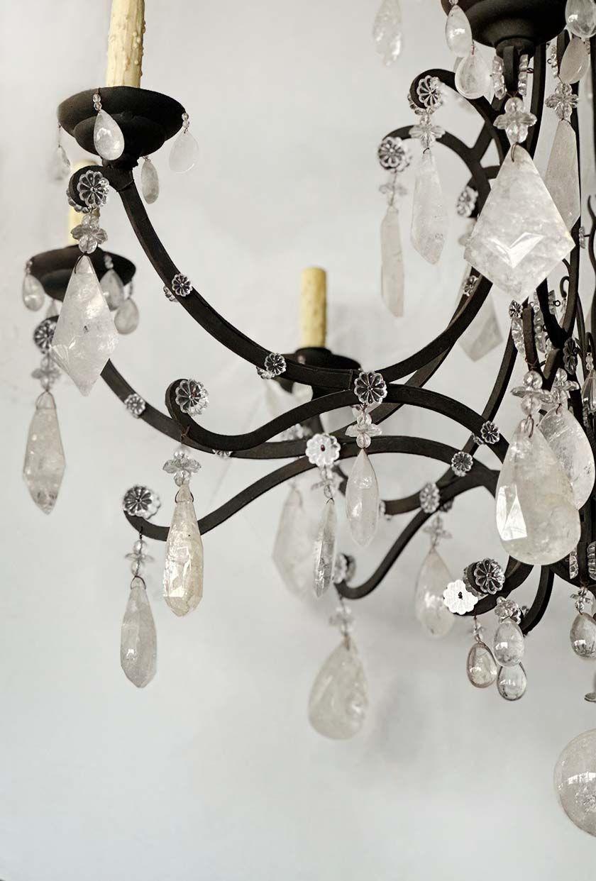Graceful large Venetian chandelier with great hand-forged wrought iron work, heavy cut rock crystal, floral shape figures and an impressive cut crystal ball. Made in Italy, c. 1950's.
*Rewired to fit US light standards.
*Chain can be modified to