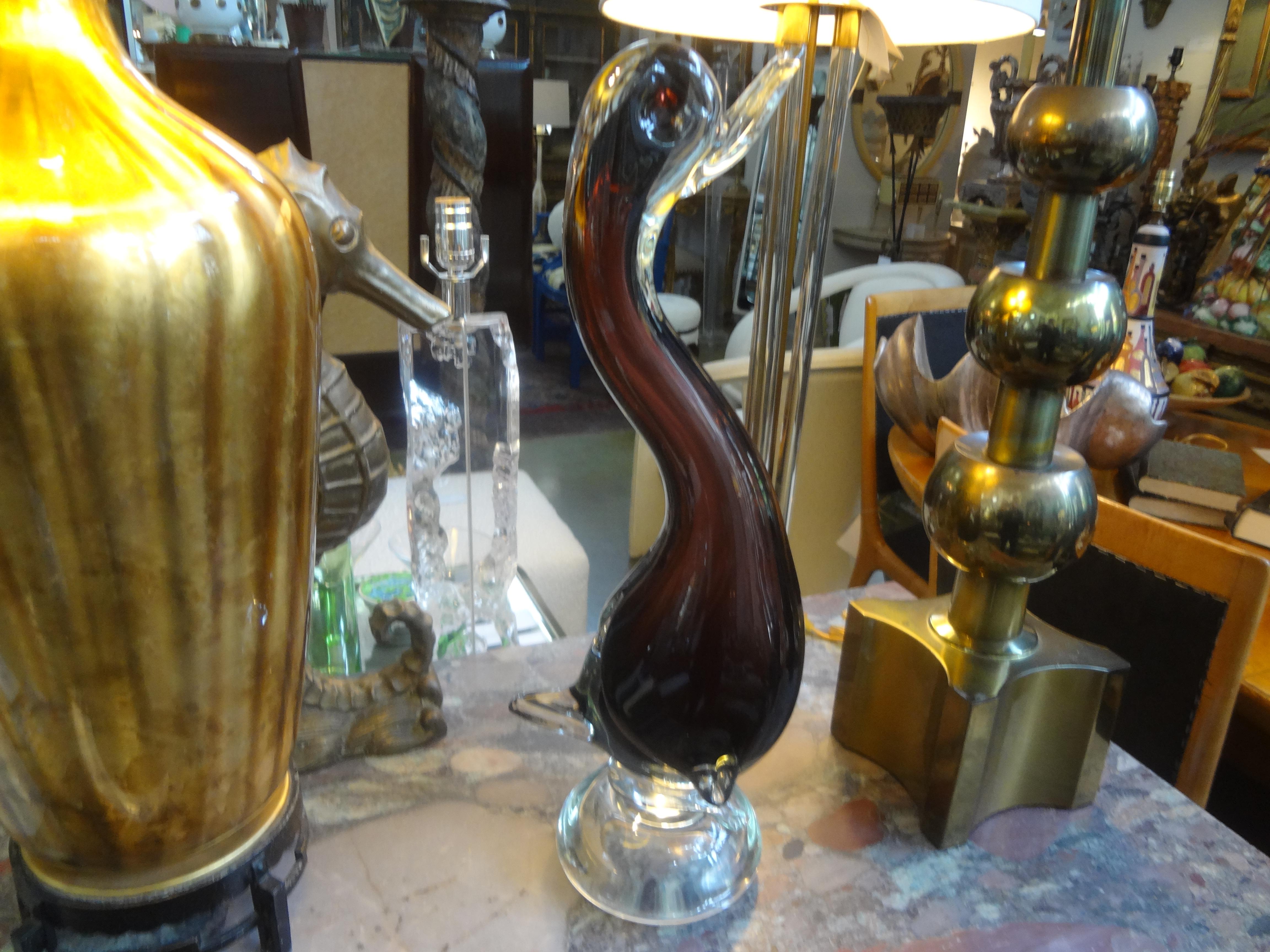 Large Venini style Murano glass duck. This stunning murano glass duck is executed in.
A beautiful shade of purple and clear. Our murano glass duck sculpture is a must have for the duck or animal enthusiast.