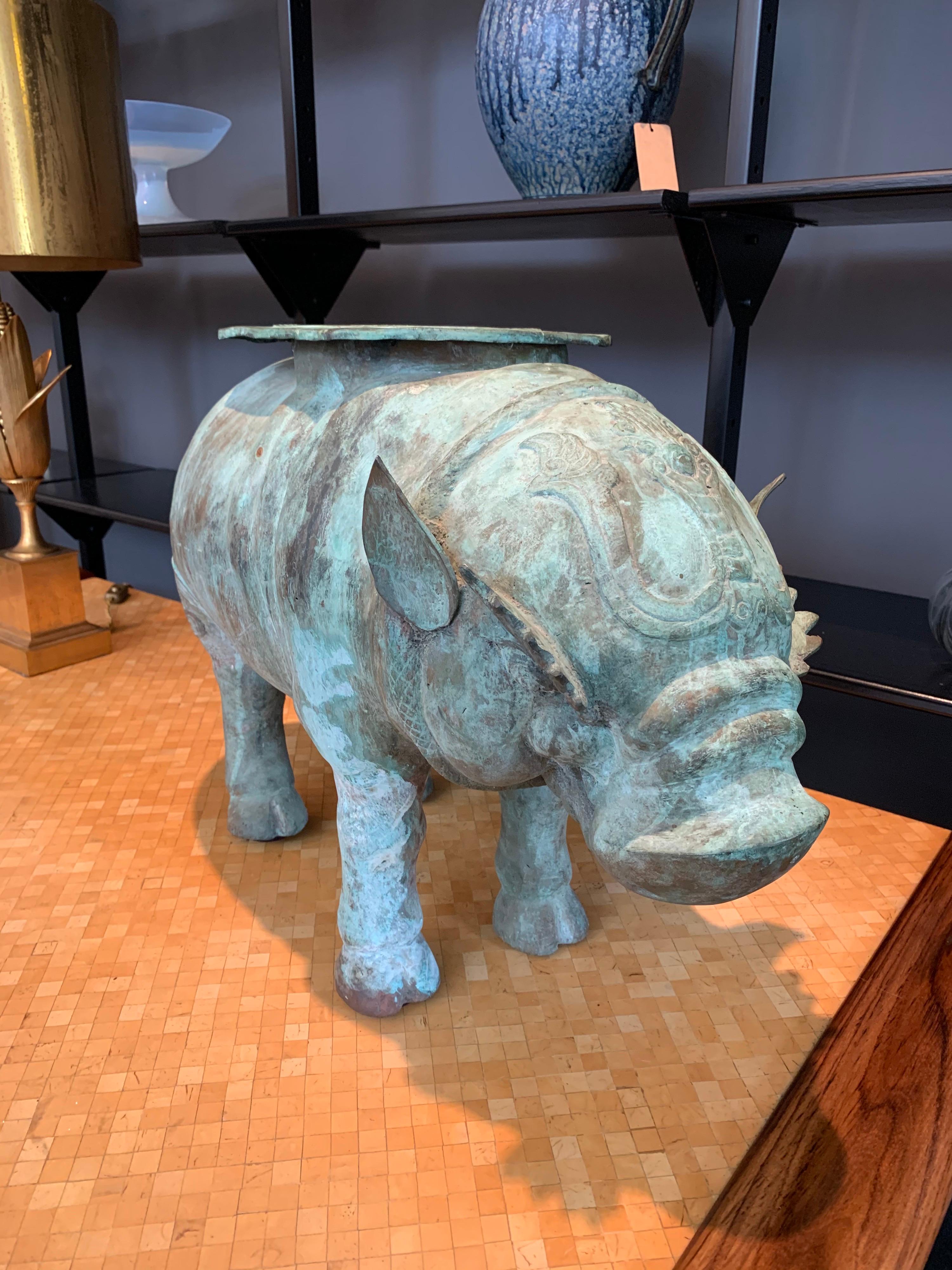 Depicting a mythological animal Hippopotamus, this sundial with a wonderful aged verdigris coloring over bronze. Perfect for outside space. Garden or also for indoor sculpture. Large scale and heavy, the Hippopotamus signifies strength and power.