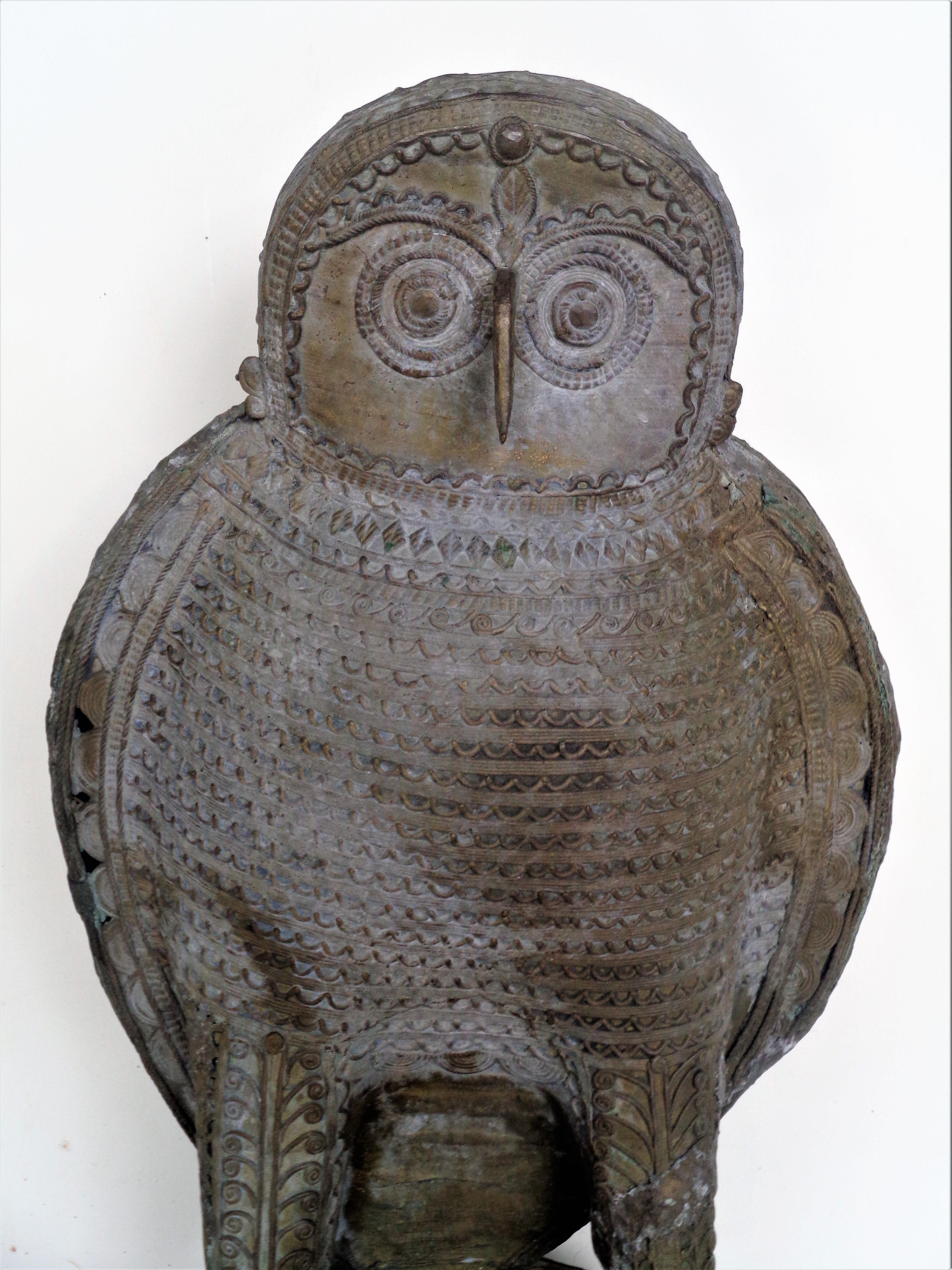 Finely detailed hand crafted zinc metal sculpture of a large standing owl on original attached bolted base. Beautifully aged weathered surface with areas of verdigris - outside for many years. India in origin. Circa 1900.
 Look at all pictures and