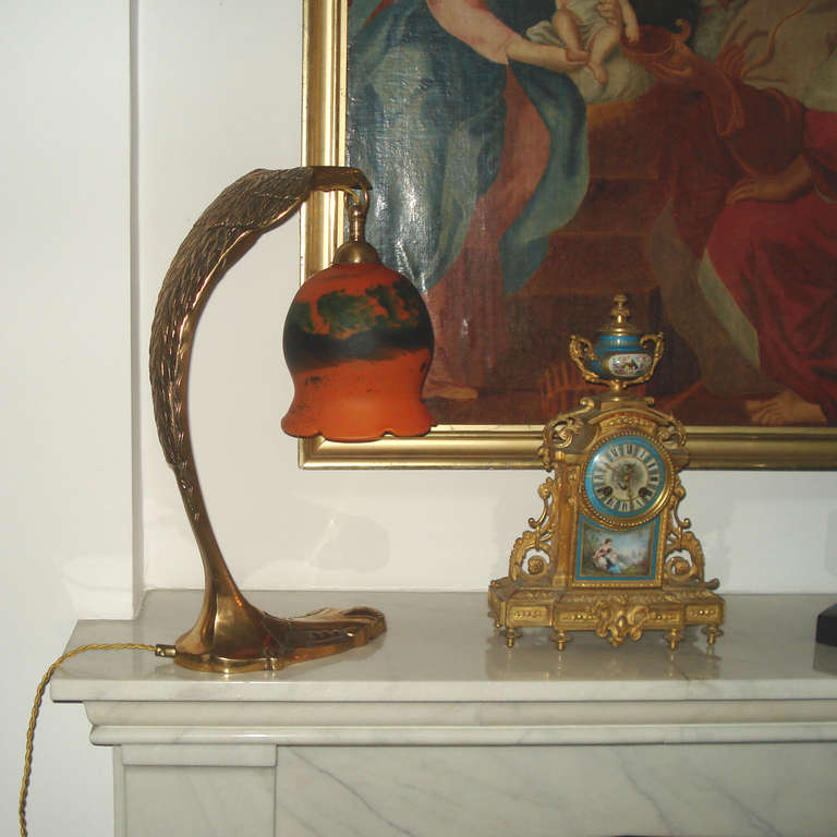 Art Nouveau table lamp by Charles Ranc, France, circa 1910

Table lamp shaped like an eagle, bronze, by Charles Ranc, signed.
Shade in French glass with powder inclusions. Signed.
Excellent original condition with normal wear of time, bayonet