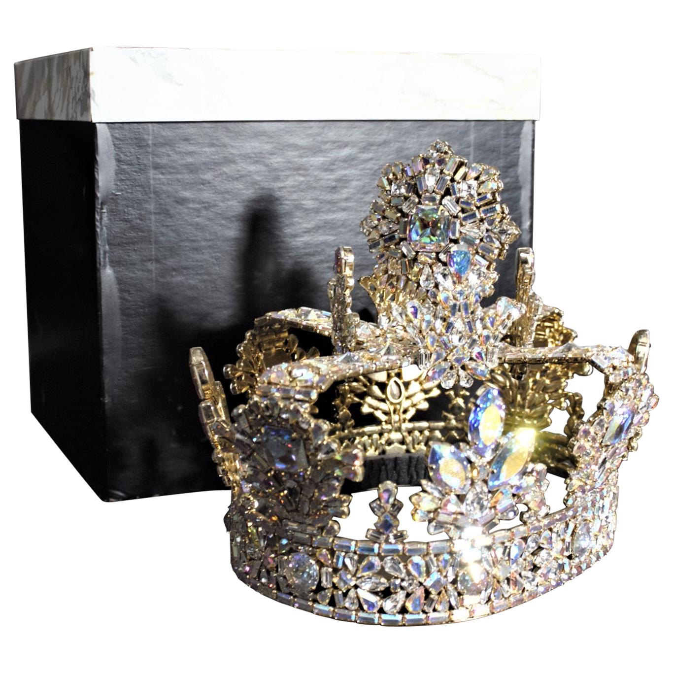 This full sized and very elaborate rhinestone crown is completely unsigned, but presumed to have been made in Canada in circa 1975 in a Victorian or Edwardian style. The crown is composed of a series of literally hundreds of clear Aurora borealis