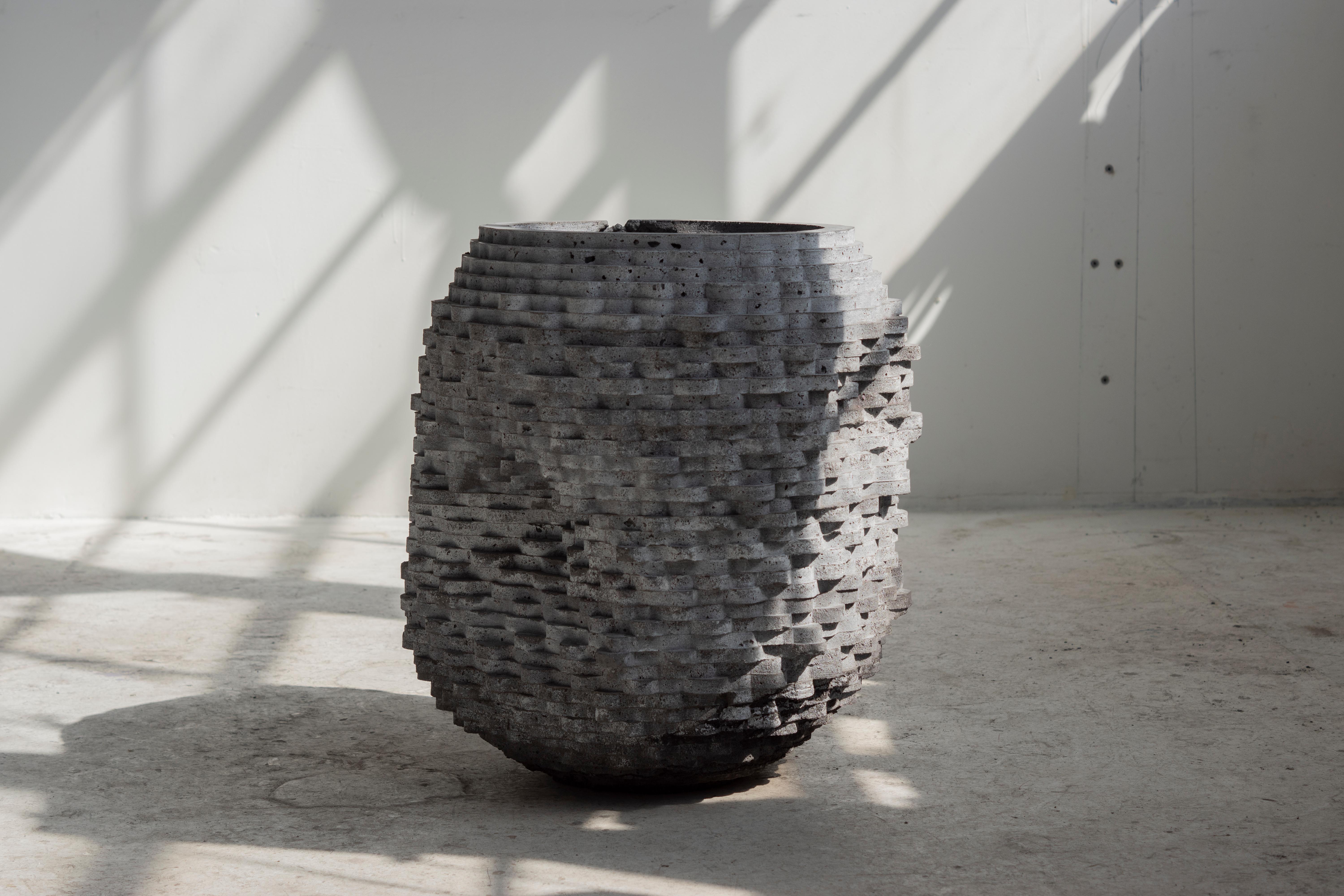 Large hand-cast vessel for indoor and outdoor use. Drainage holes can be added.

At the intersection of art, craft, and design, Concrete Poetics' debut collection of hand-cast cement sculptural furniture and accessories streamlines visually