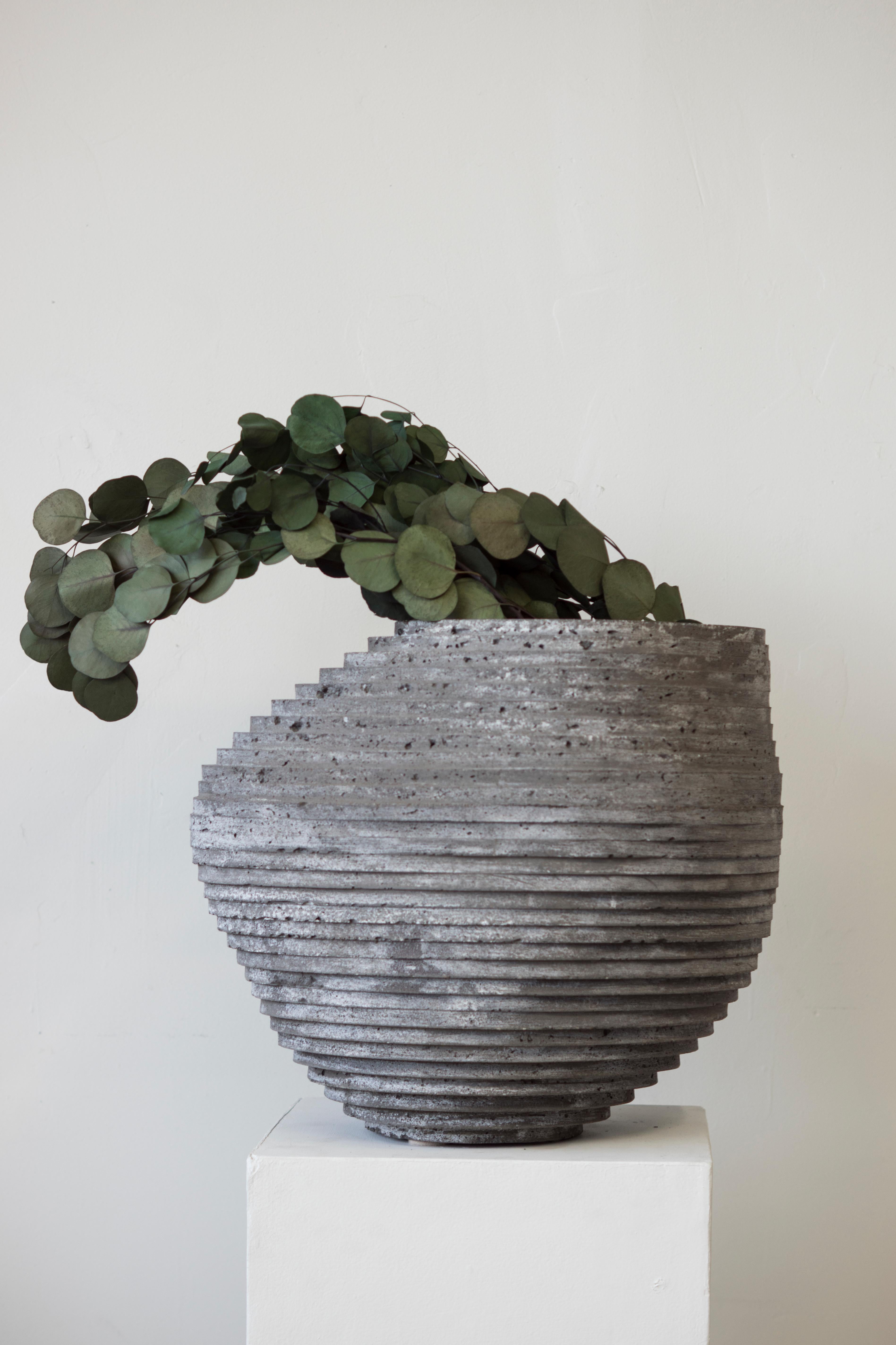 Large vessel for indoor and outdoor use. Can be made with drainage holes.

At the intersection of art, craft, and design, Concrete Poetics' debut collection of hand-cast cement sculptural furniture and accessories streamlines visually intriguing and