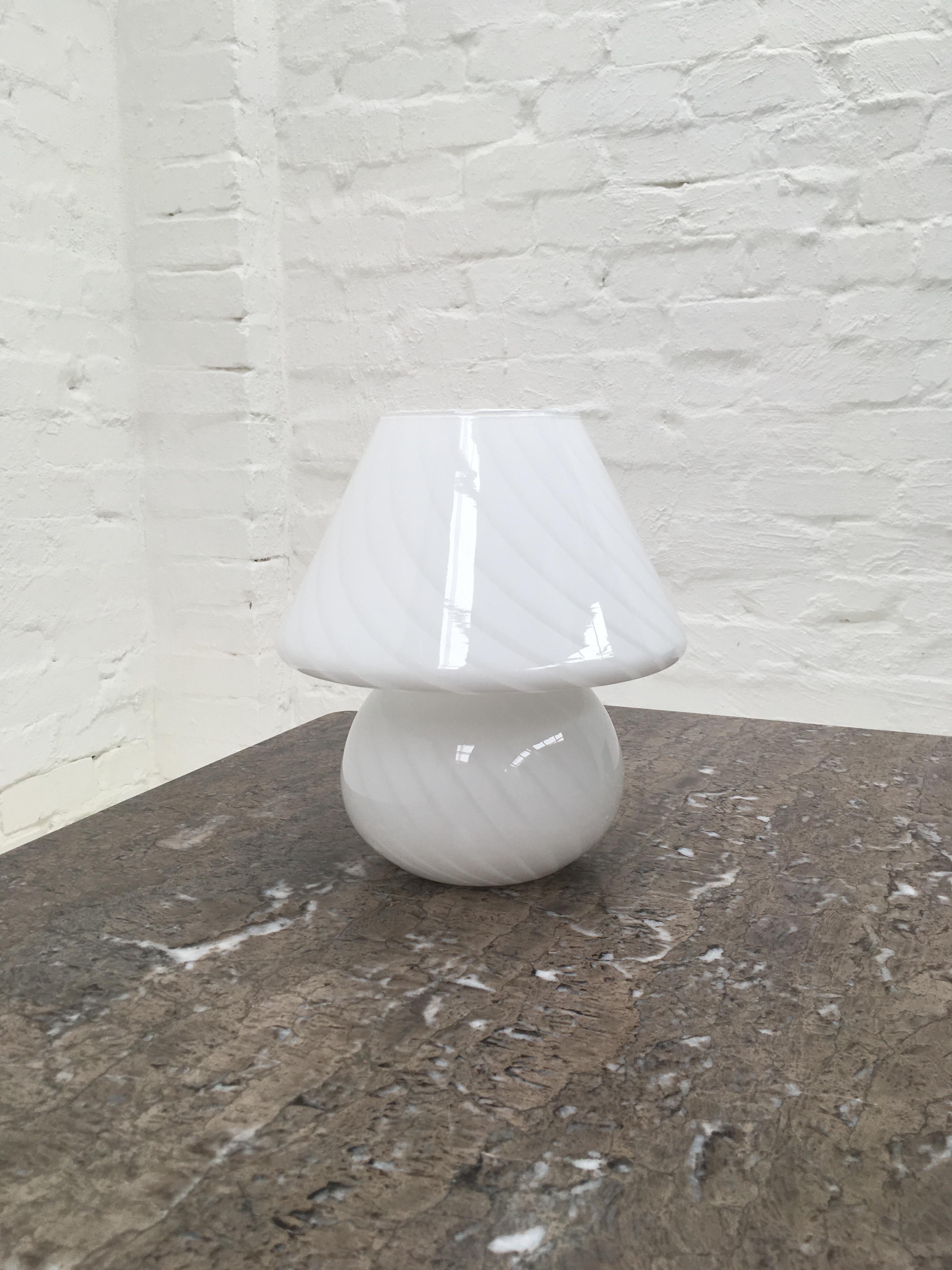 A medium to large size Classic Murano mushroom lamp. A most attractive off-white color.

These lamps were produced in the 1960s and 1970s by many of the Murano glass producers as a communal design, sold simply as ‘Vetri Murano’ or Murano glass. If