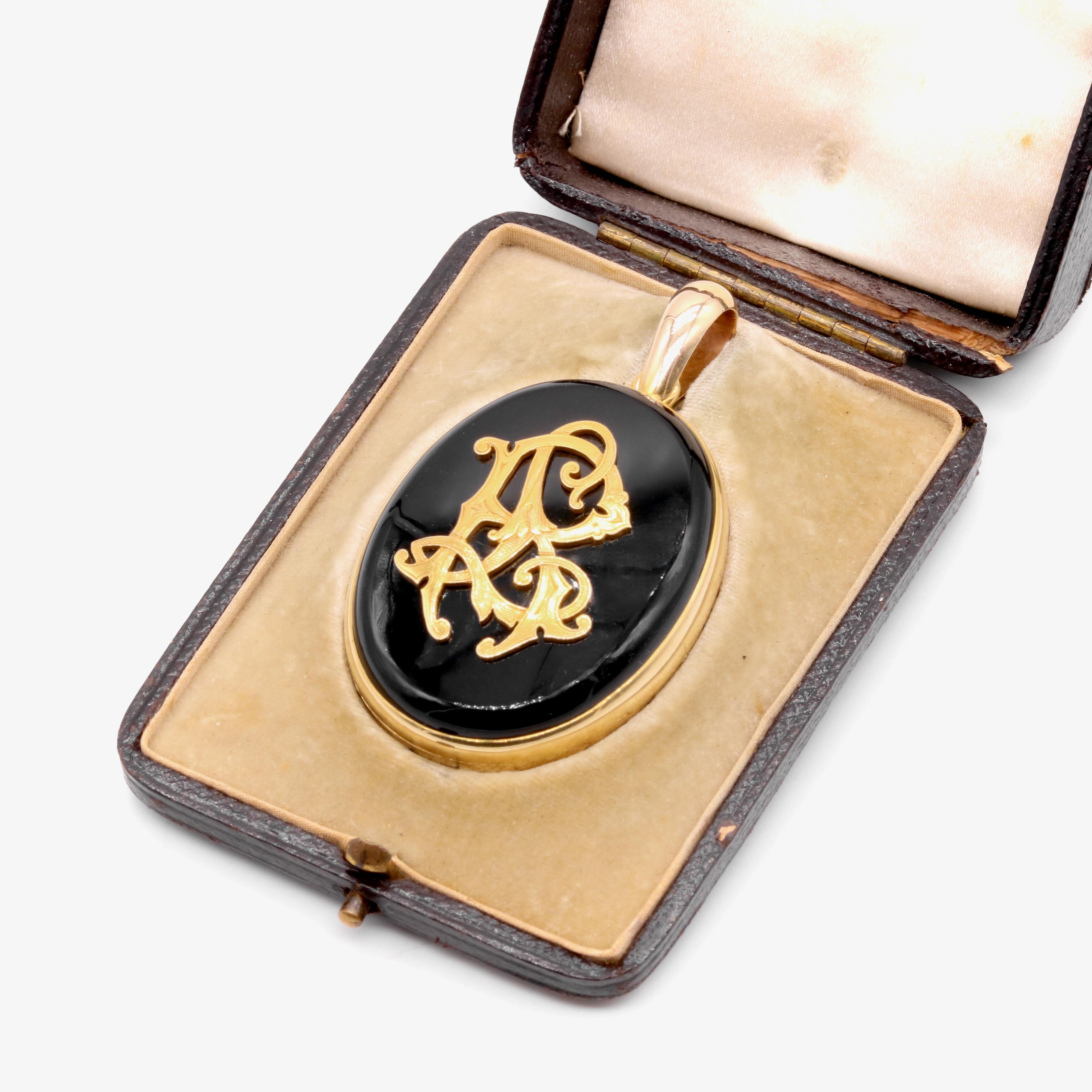 A Victorian onyx, diamond, and yellow gold locket, comprising two onyx cabochons, and 52 rose cut diamonds, with two glass-covered compartments, in 15 karat yellow gold and 9 karat yellow gold. 

My favourite thing about this Victorian Gold Diamond