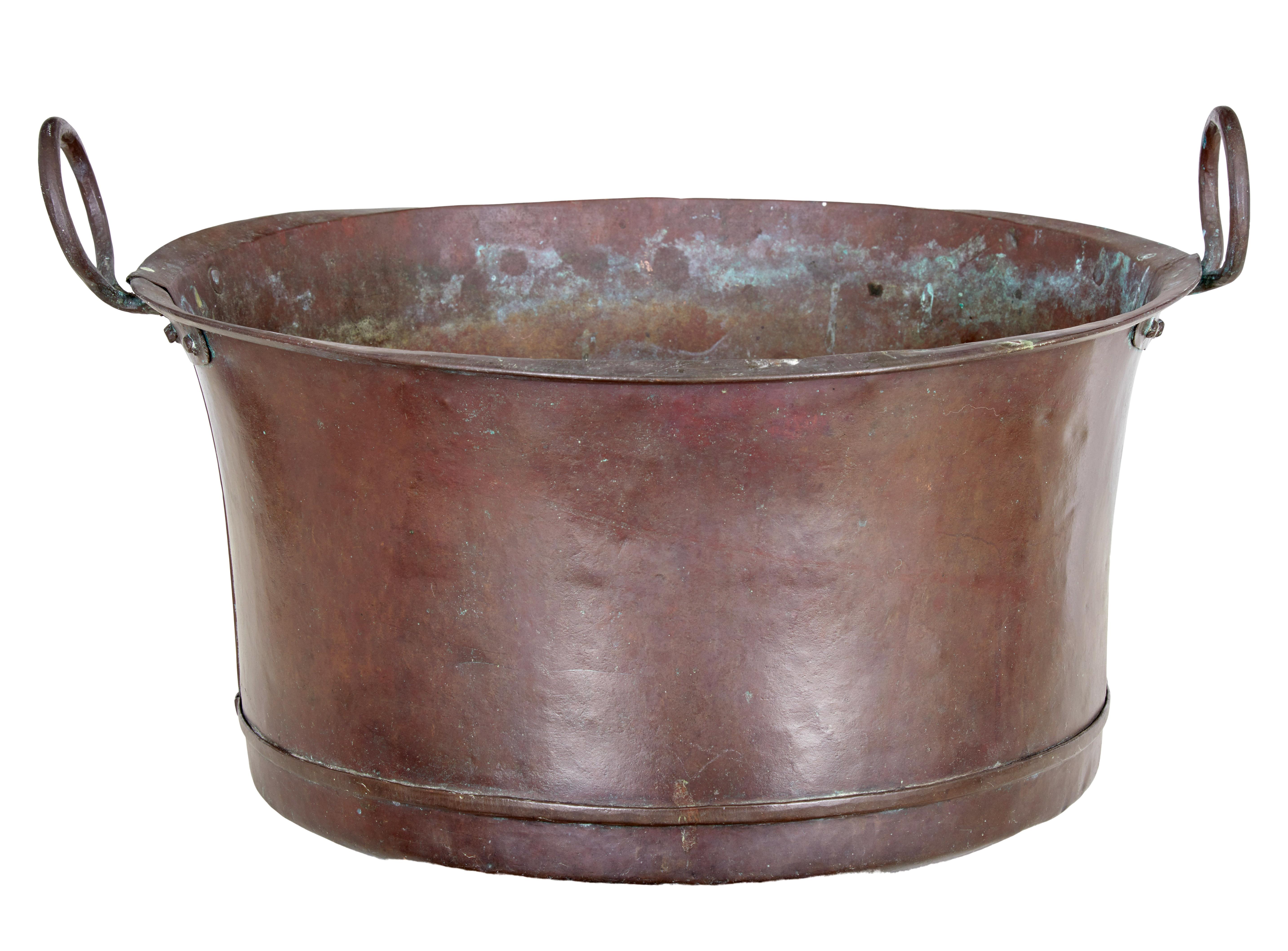 Large Victorian 19th century copper cooking vessel, circa 1890.

Rustic rounded bottom cooking vessel, which would now make an ideal log or waste paper bin.

Round in shaped with large hooped handles.

Expected surface marks and minor dents.