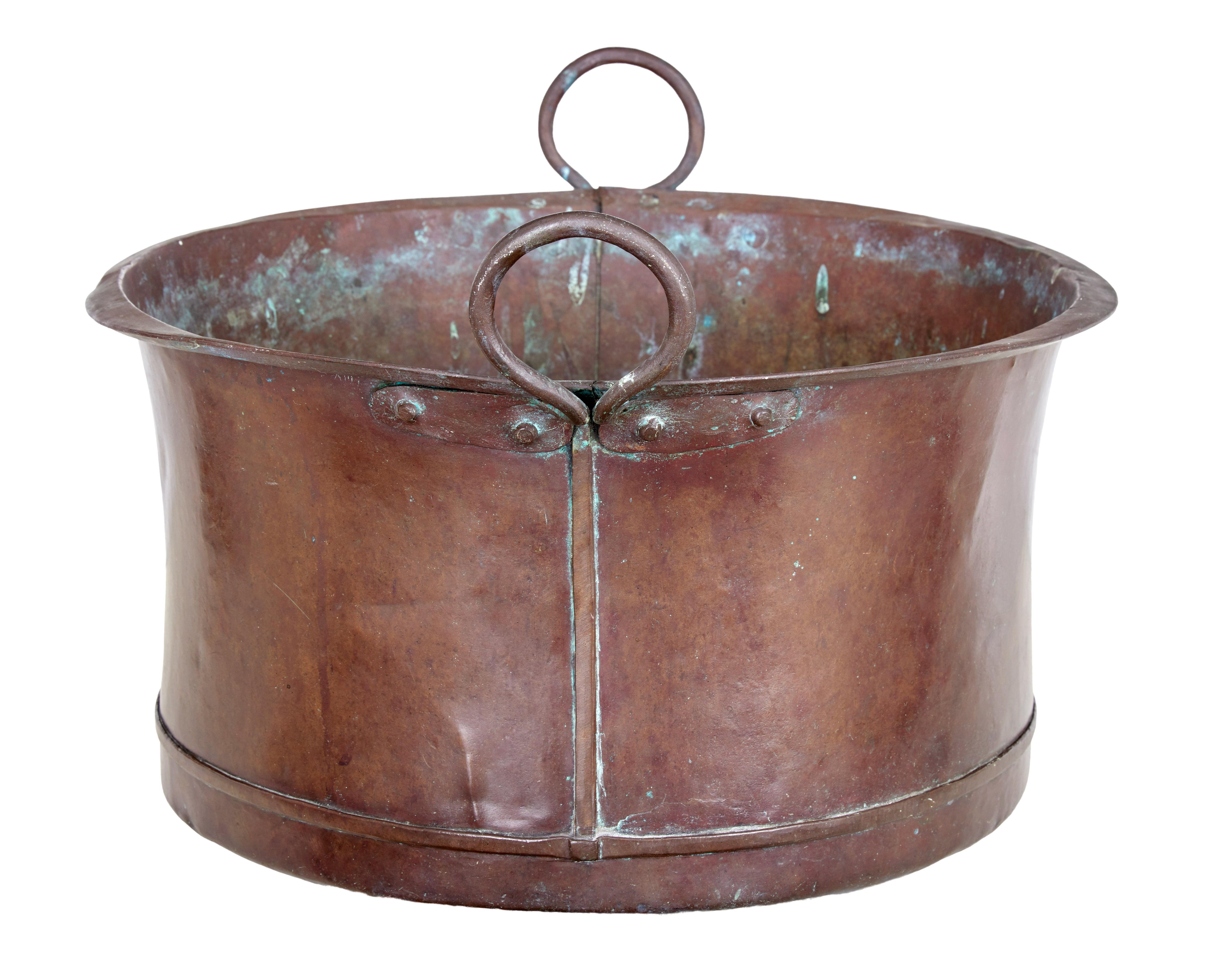 Large Victorian 19th century copper cooking vessel circa 1890.

Rustic rounded bottom cooking vessel, which would now make an ideal log or waste paper bin.

Round in shaped with large hooped handles.

Expected surface marks and minor