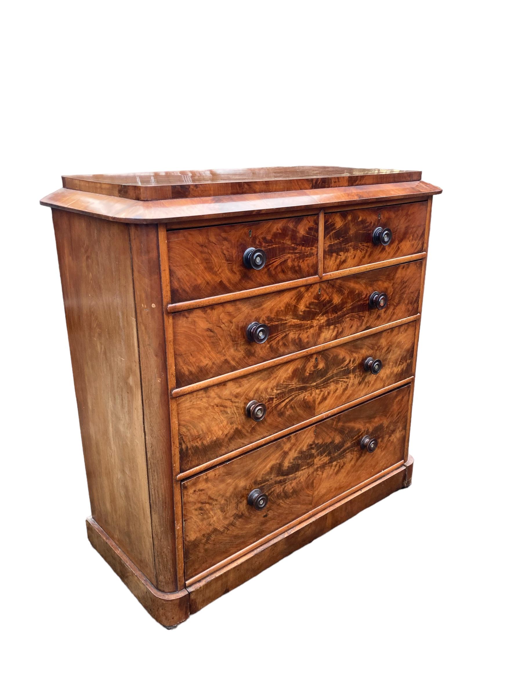 Large Victorian 2 over 3 Graduated Mahogany Chest of Drawers. Beautiful high grade pattern and Colouration to the wood, original back and handles. Bottom drawer built into the plynth, typical of a late 19th Century design. A classic example of this