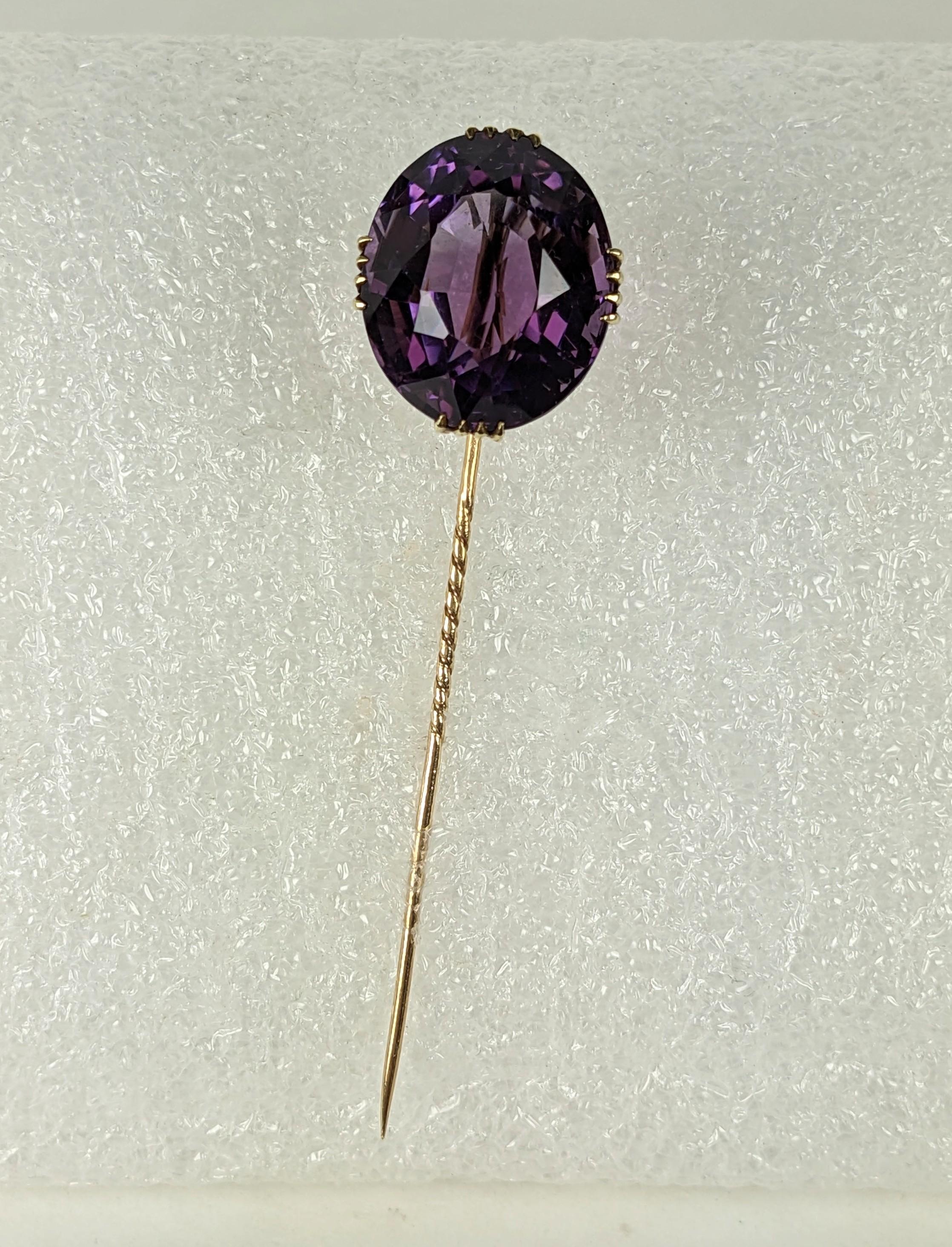 Large Victorian Amythest Stickpin set in ornate 14k gold setting. Large high quality oval cut amythest  with intense color, measuring 20mm x 18mm. Gorgeous hand etched surround with tapered prongs. Marked 14K on staff. 1880's USA. 3