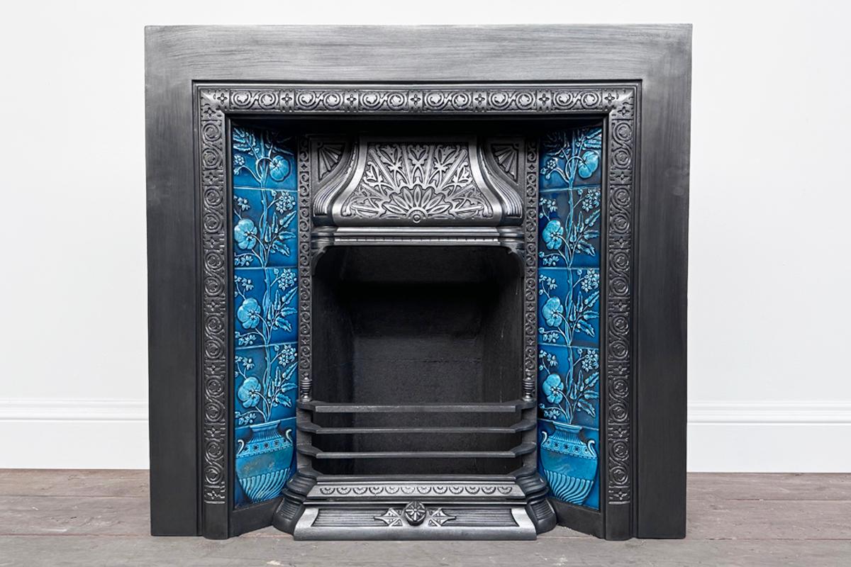 Large Victorian cast iron and tiled fireplace grate. Circa 1880. Finished with traditional black grate polish and supplied with a new clay fireback and cast iron stool grate ready for a real fire. We can also supply a living flame gas fire for this