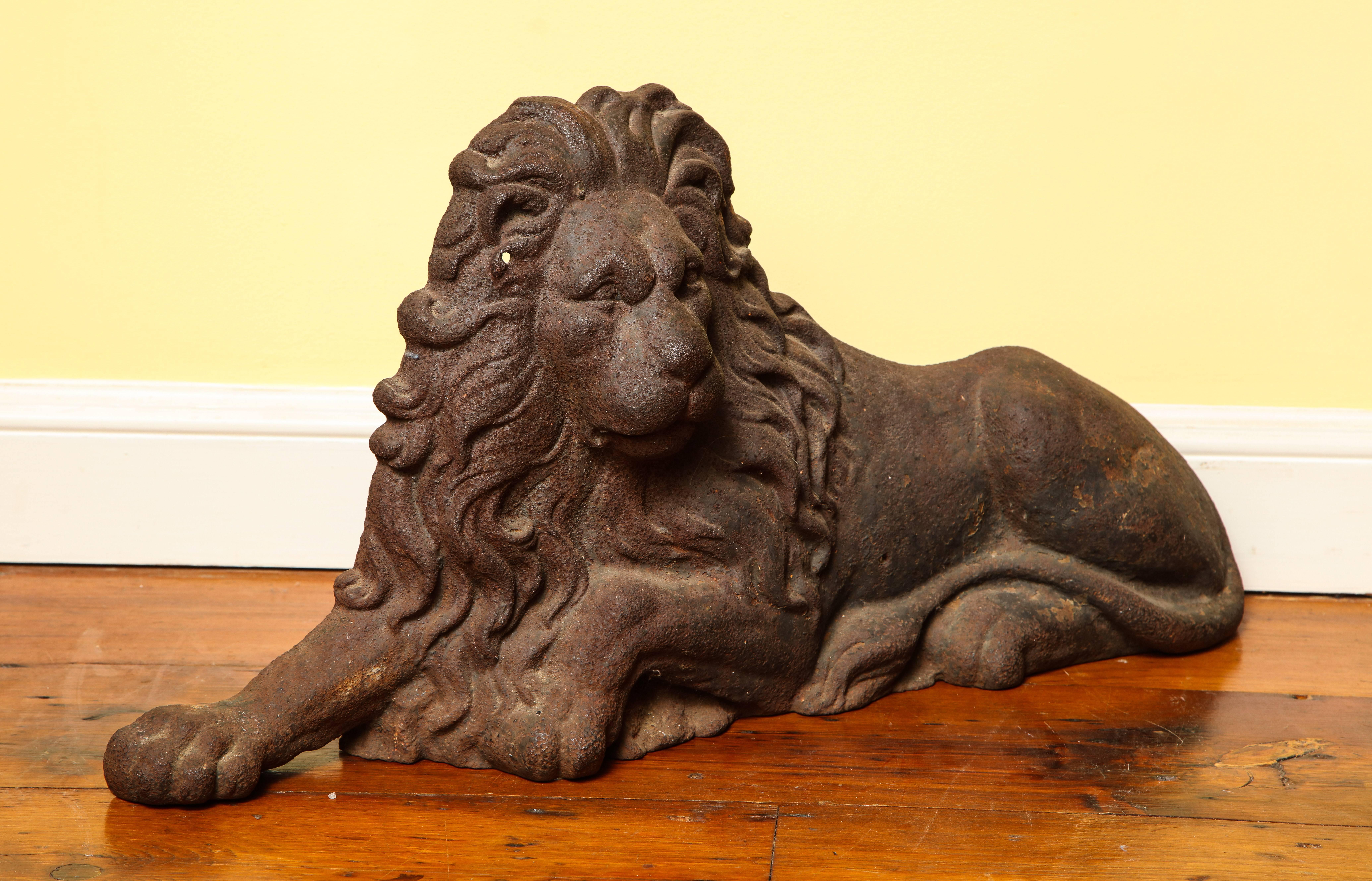Large Victorian finely cast iron relief figure of a recumbent lion English, circa 1850.

Measures: Height 14