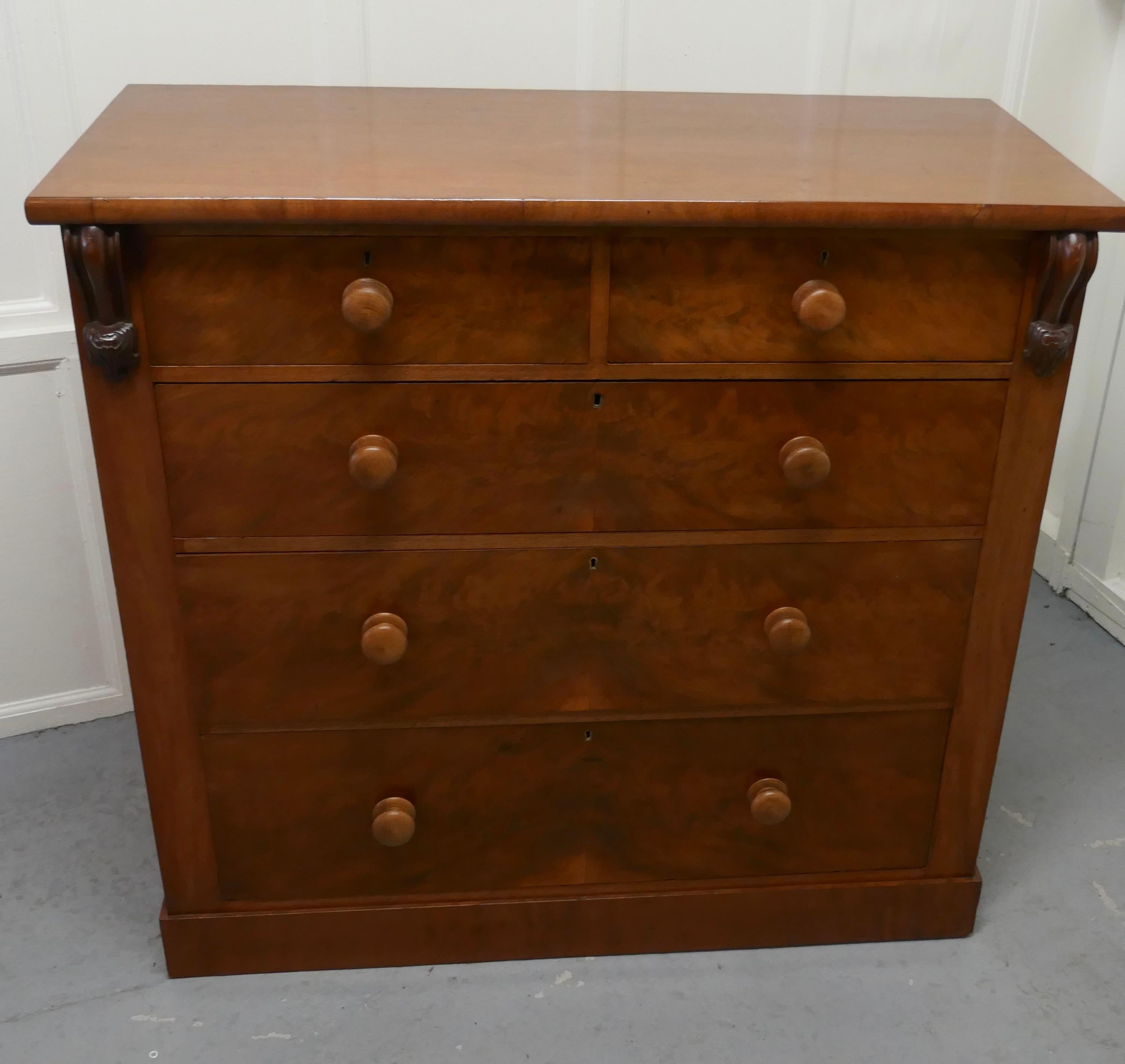 Large Victorian Chest of Drawers 

Victorian Figured Walnut chest of drawers, the chest has 2 carved corbels on the front, it has 2 short over 3 graduated drawers with turned wooden knobs

The chest is in very good condition, it has a good colour