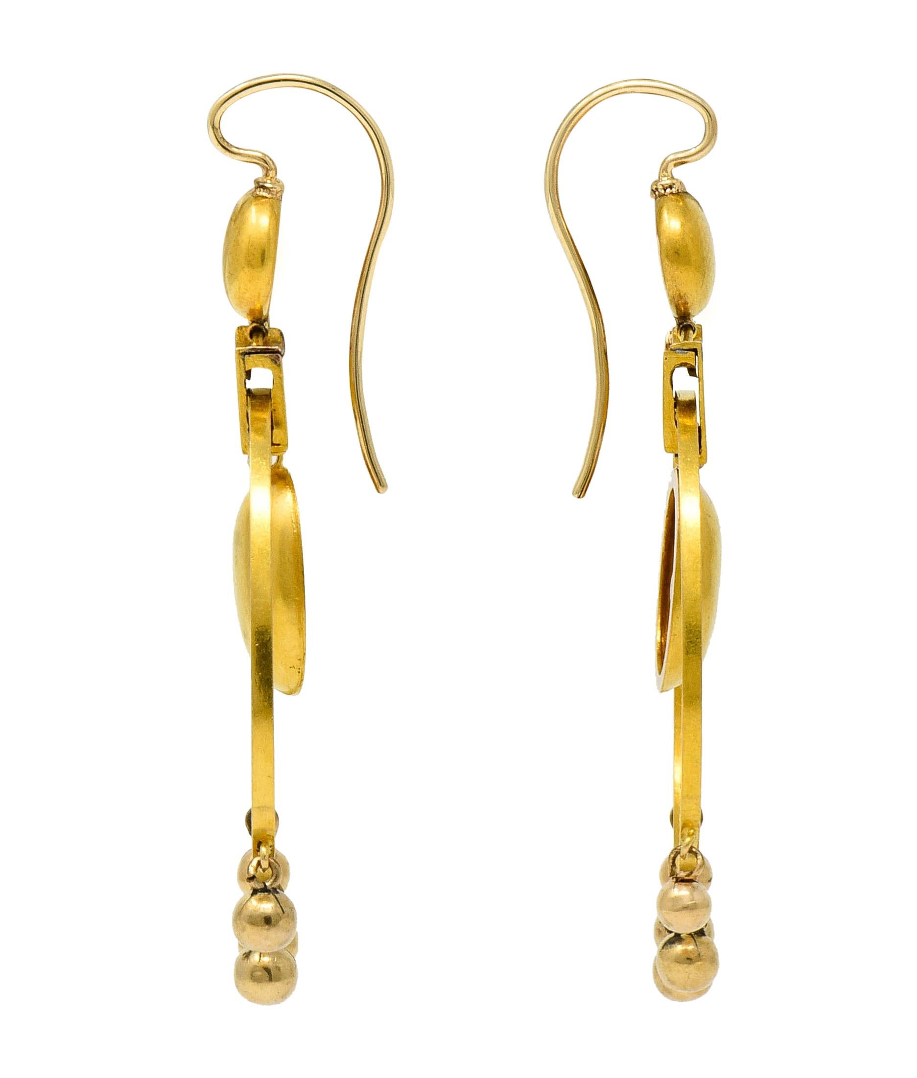 Large lightweight chandelier earrings designed with two domed forms, a round surmount and oval center

With an articulated matte gold surround accented by festive gold bead drops

Completed by a shepherd's hook ear wire

Tested as 18 karat