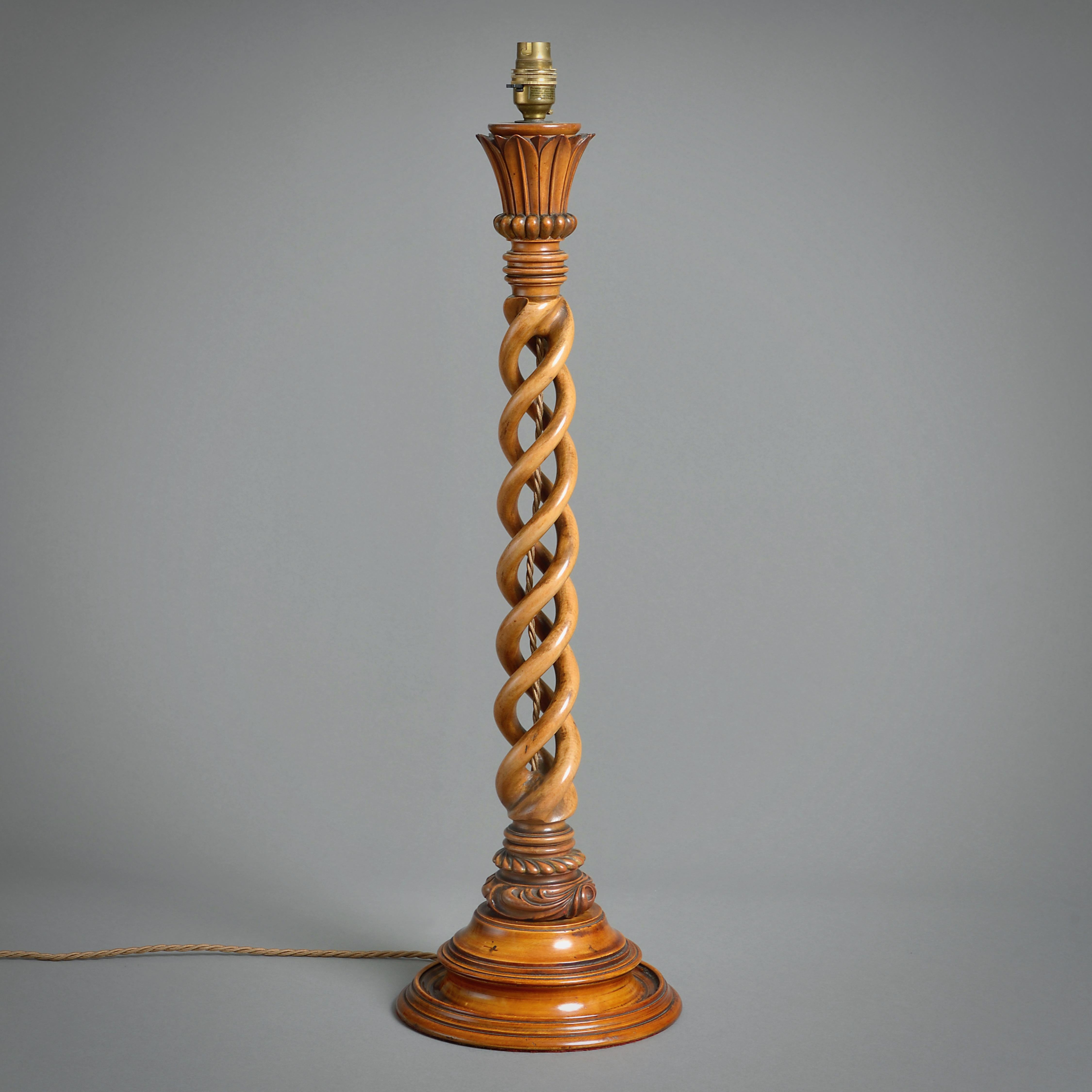 A LARGE EARLY VICTORIAN FRUITWOOD SPIRAL-TURNED TABLE LAMP, CIRCA 1850.

25in. (64cm) high, excl. fitment; 8in. (20cm) diameter.