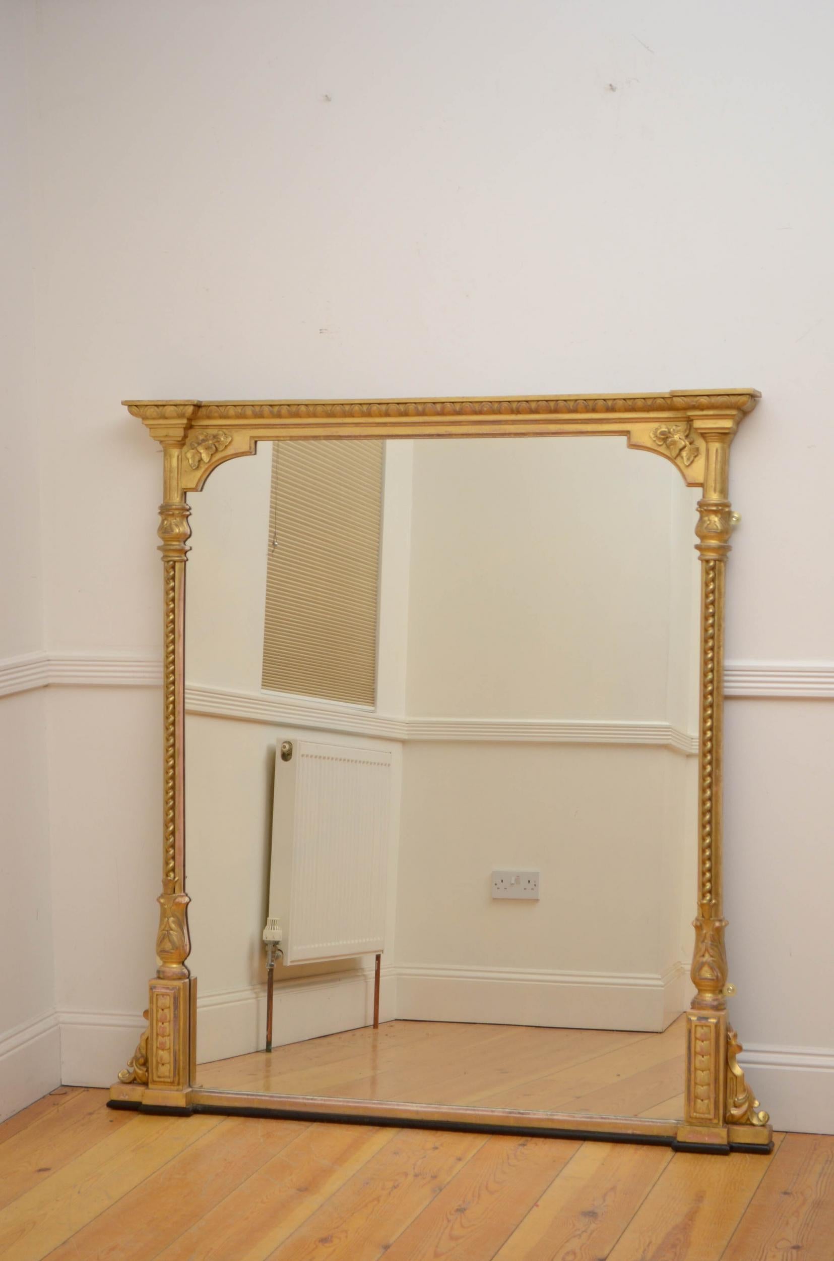 Sn5095 a large Victorian wall or overmantel mirror, having original glass with minor imperfections in moulded frame with twisted columns with floral carved capitals and egg and dart frieze all flanked by leafy scrolls to the base. This antique