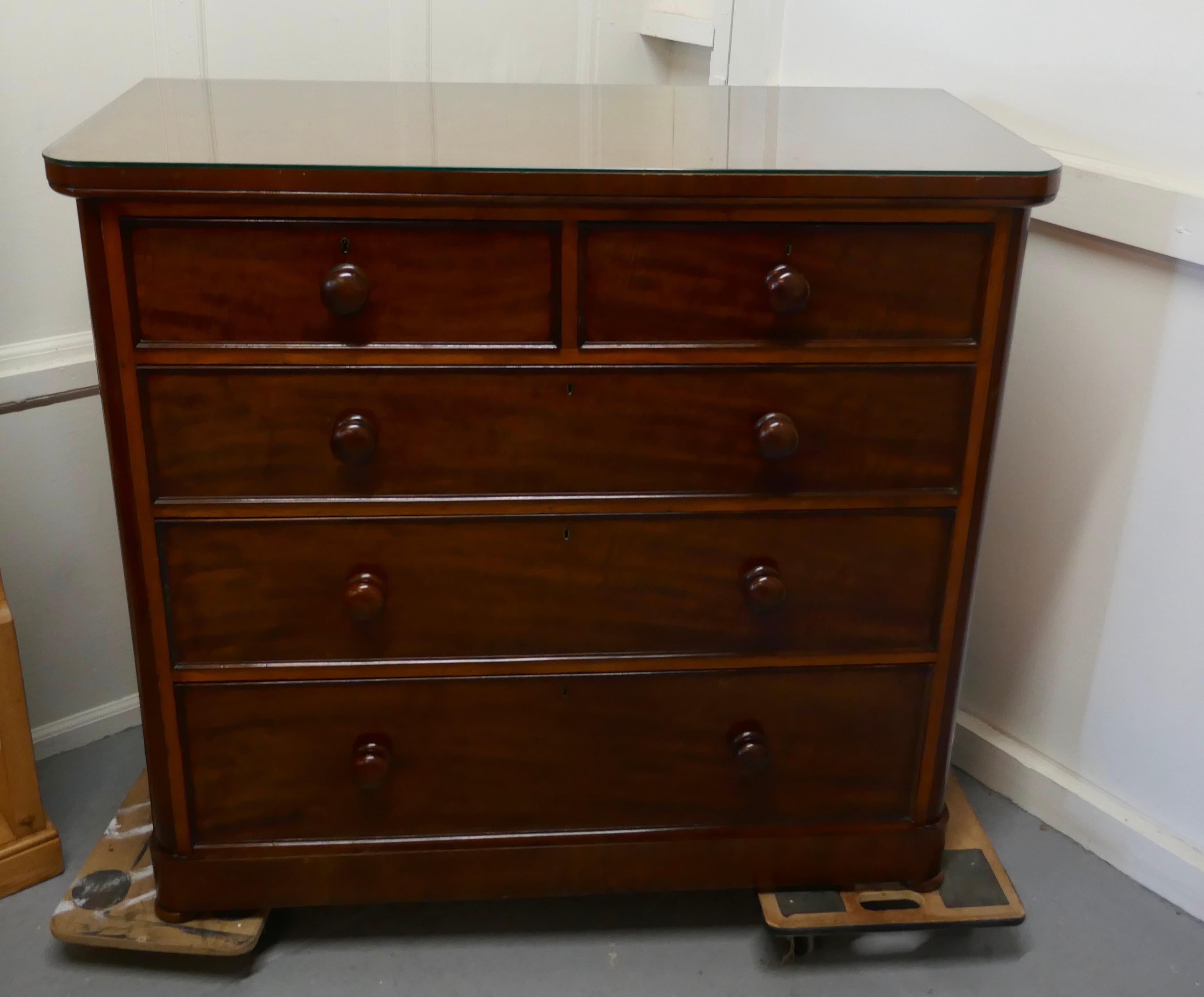 Large Victorian mahogany chest of drawers

Victorian mahogany chest of drawers, with a deep mahogany top, the chest has 2 short over 3 graduated drawers, and has a plate glass cover which has protected the finish on the top, very useful

The