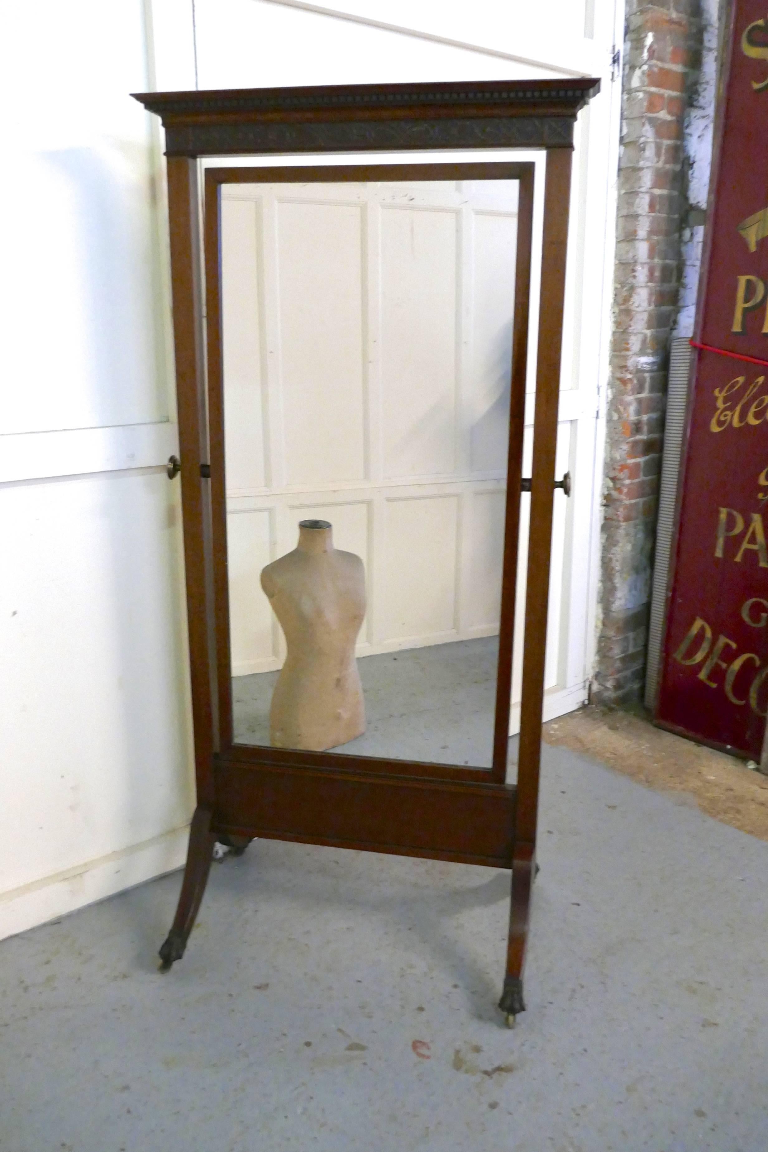 Large Victorian mahogany cheval mirror
 
This is a very stylish and elegant piece it is made in mahogany, it has a delicate dentil cornice and sits squarely in its stand held in place either tilting or upright by chunky brass knobs 

The stand