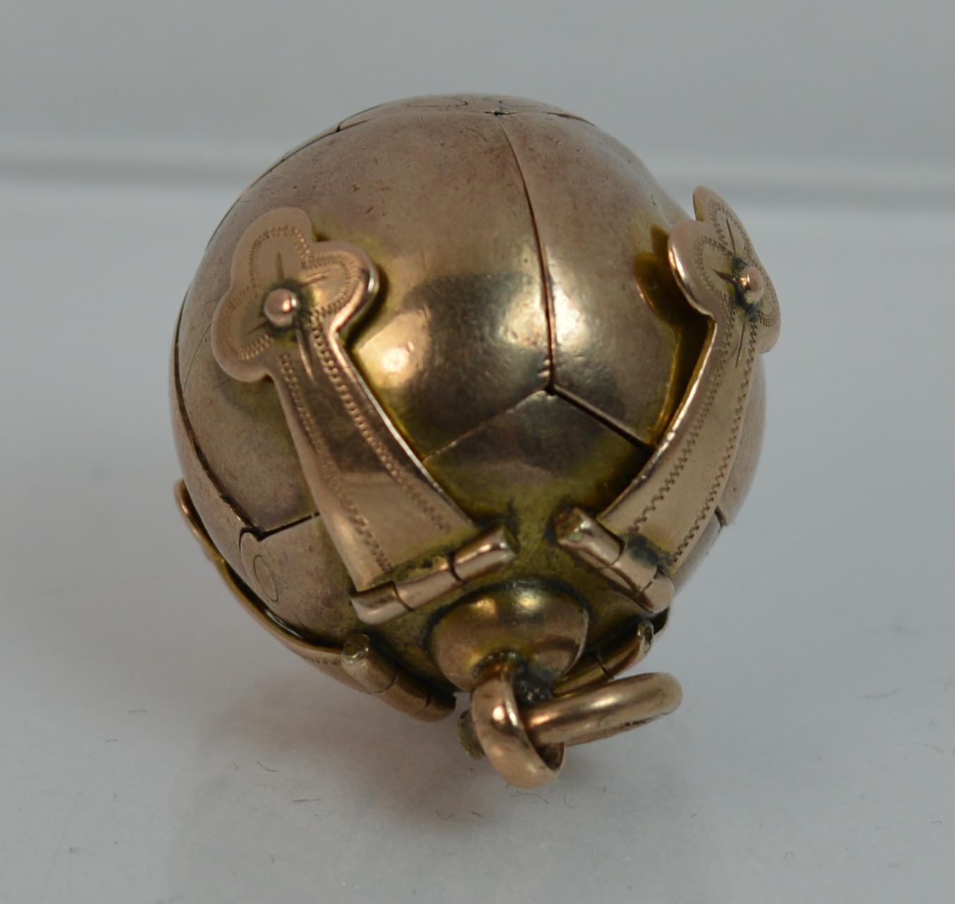 

Fine quality solid Masonic / mason's ball. Opens up fully. Stylish piece. 9ct rose gold on silver ball and solid 9 carat gold top. True antique example, rare to find a true antique piece. Each claw to the top has its own hinge.

CONDITION ; Good
