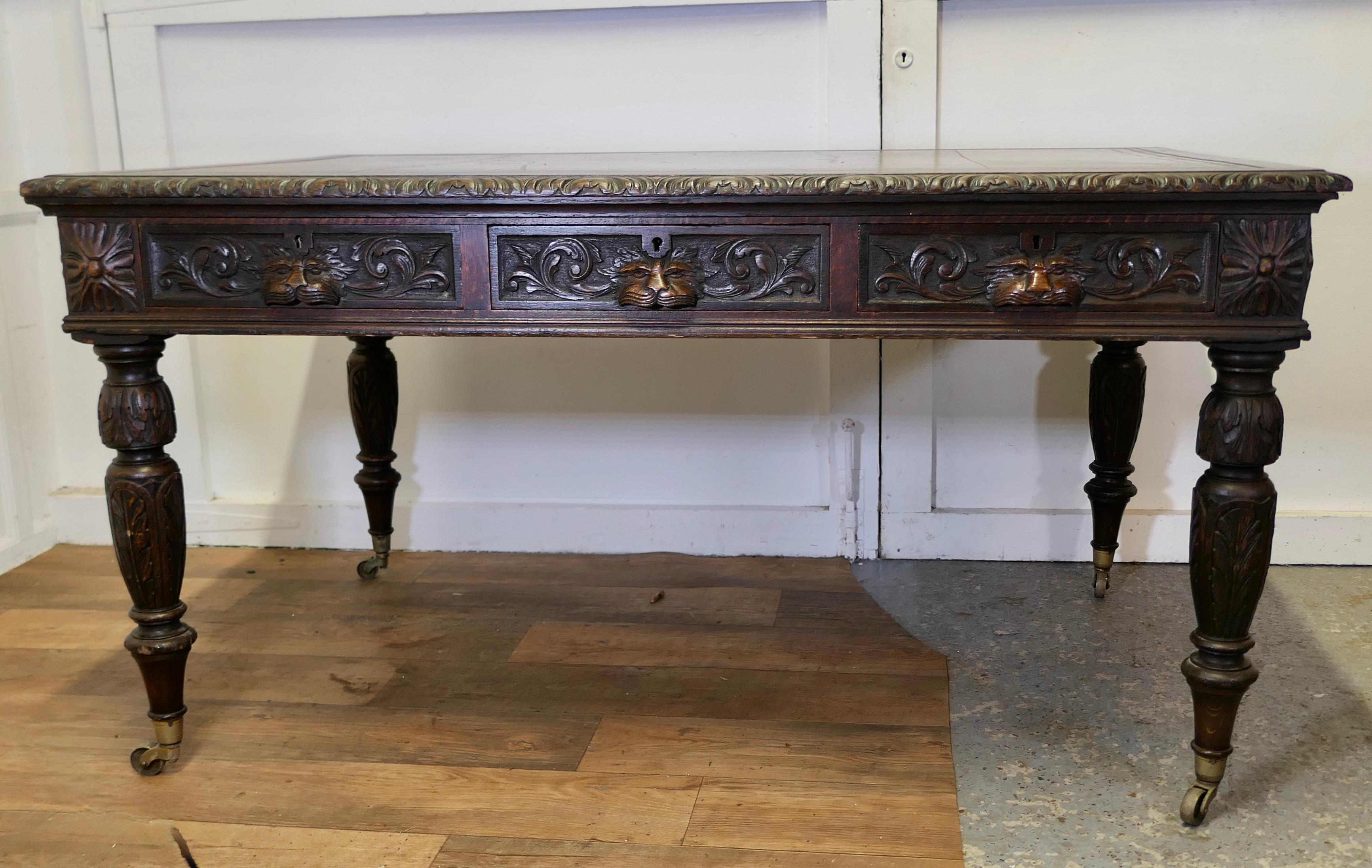  Large Victorian Oak Leather Top Partners Desk, EDWARDS & ROBERTS Library Table

This is a large piece, the table stands on heavy turned and carved legs set on brass casters, it has 3 drawers set into the apron along each side, these have superbly