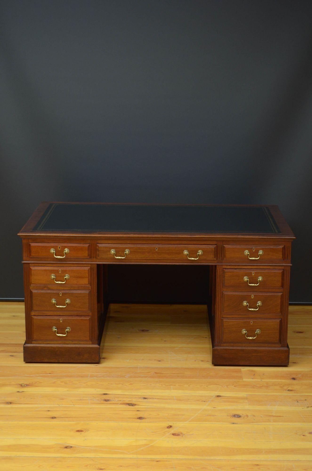 Sn5279 A large late Victorian mahogany desk, having new black tooled leather to the top above three frieze drawers and three graduated drawers to each pedestal, all mahogany lined, fielded and fitted with original brass handles, standing on moulded