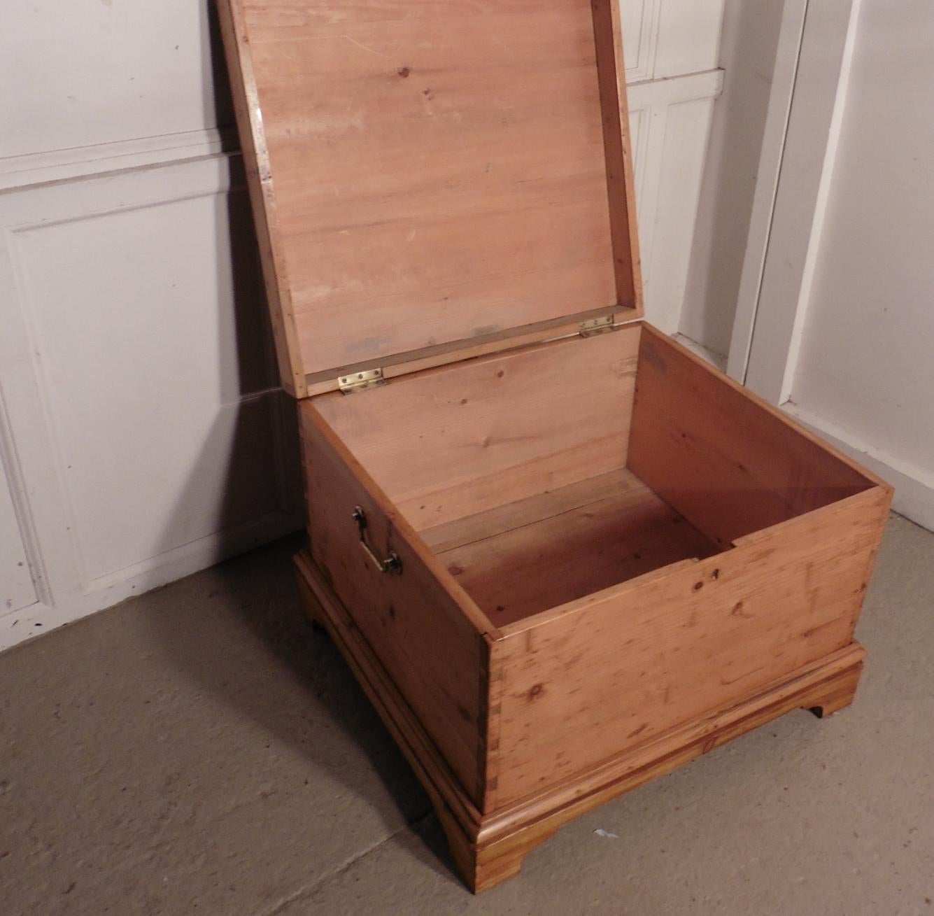 Large Victorian pine blanket box or coffee table

This is a square and very good quality pine box, the box stands on a bracket footed plinth which runs all the way around making it good to look at from all sides
The box has brass hinges and