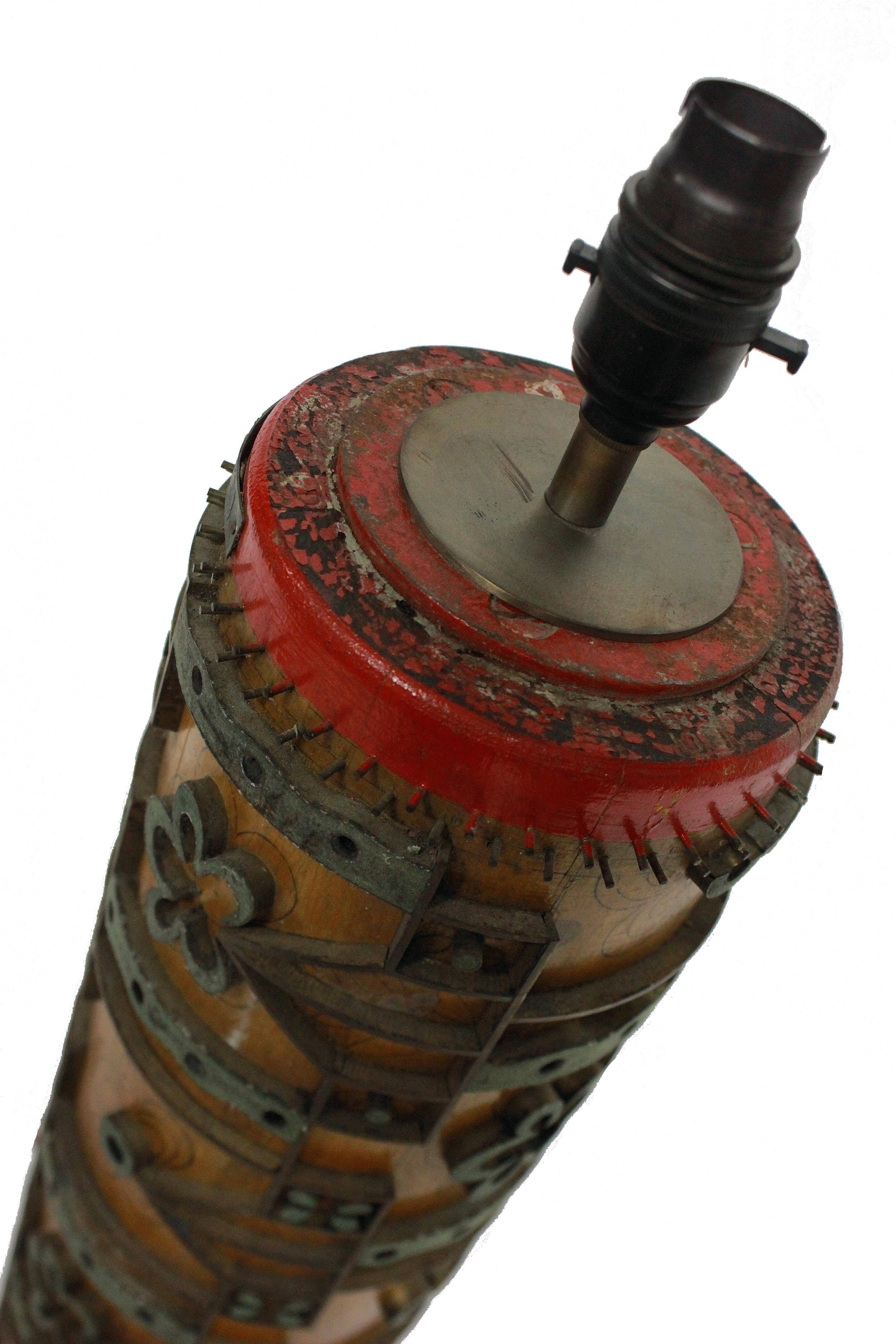 A large English Victorian print roller, now converted into a lamp.