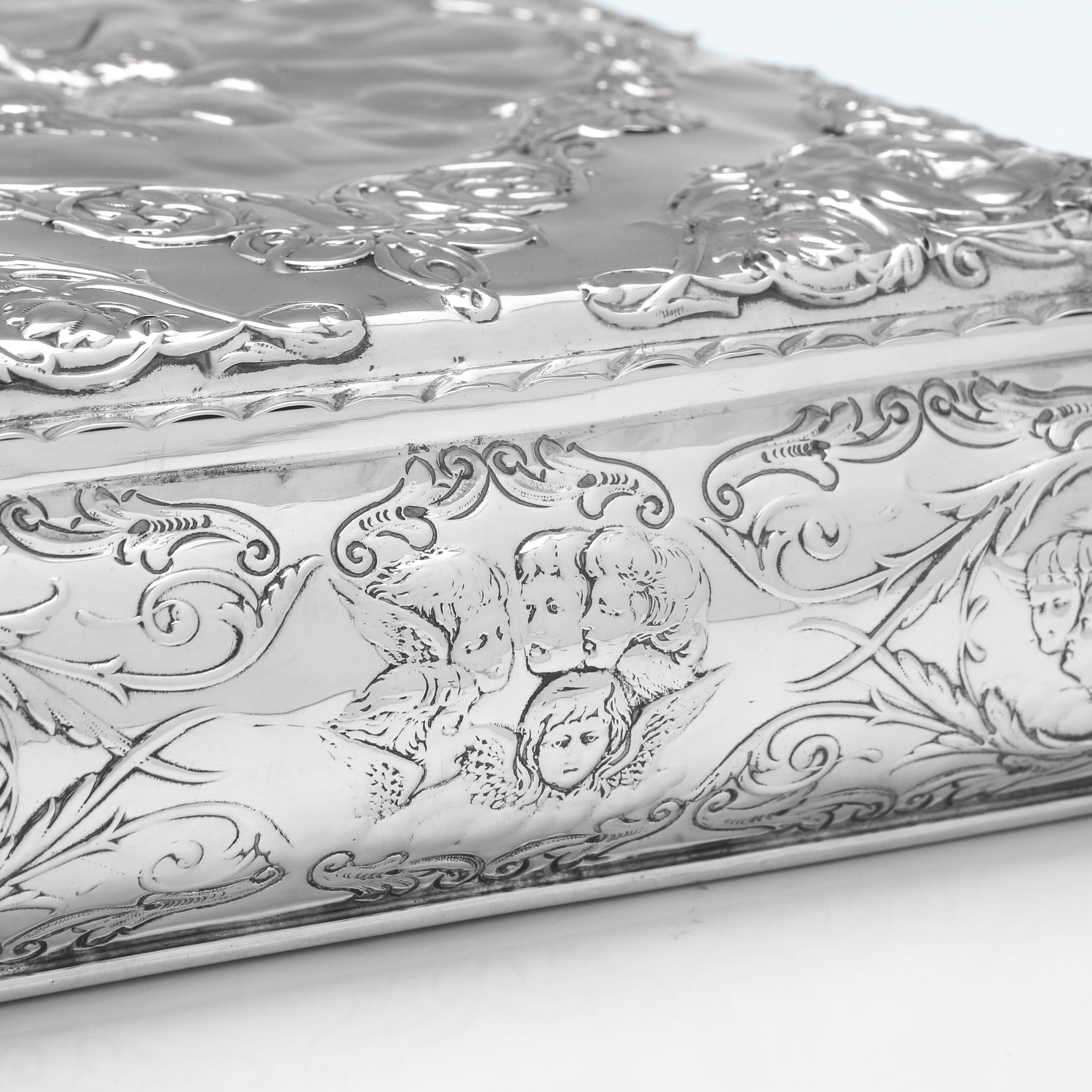 English Large Victorian sterling silver jewellery box with Reynolds Angels decoration For Sale