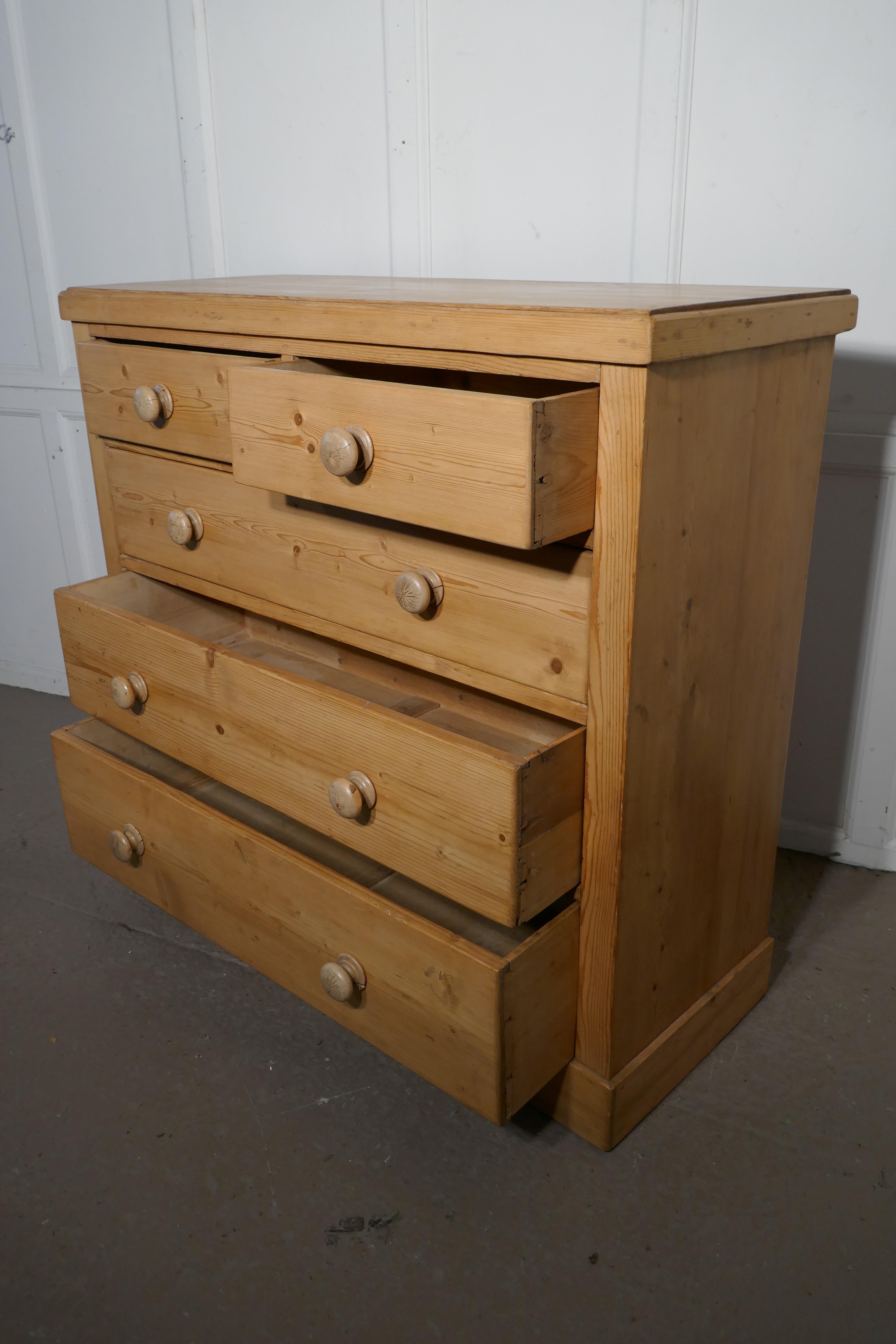 Large Victorian stripped pine chest of drawers

This lovely old pine chest of drawers has two short drawers at the top and three longer graduated drawers beneath and it has original turned wooden knob handles
The chest stands on a bracket footed