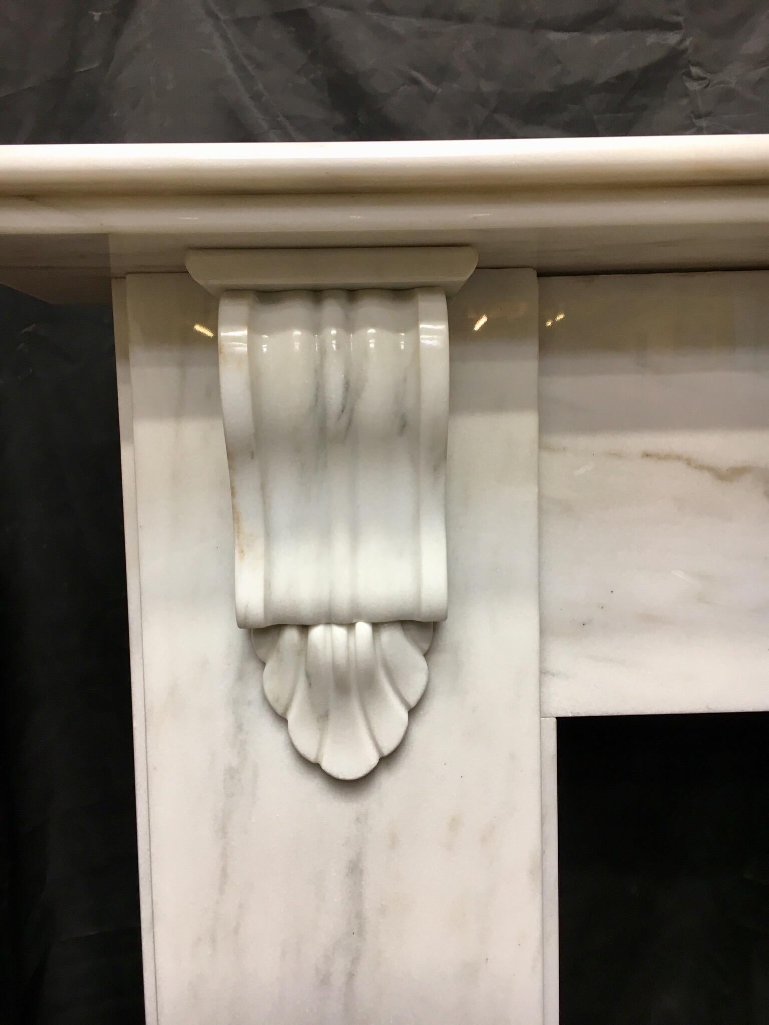 A large and masculine period lightly veined statuary marble corbel fireplace surround, fully cleaned and polished. Would suit a large wood burning stove.
Fire opening size: 990mm high x 1110mm wide (opening width is adjustable in or out)
Each leg