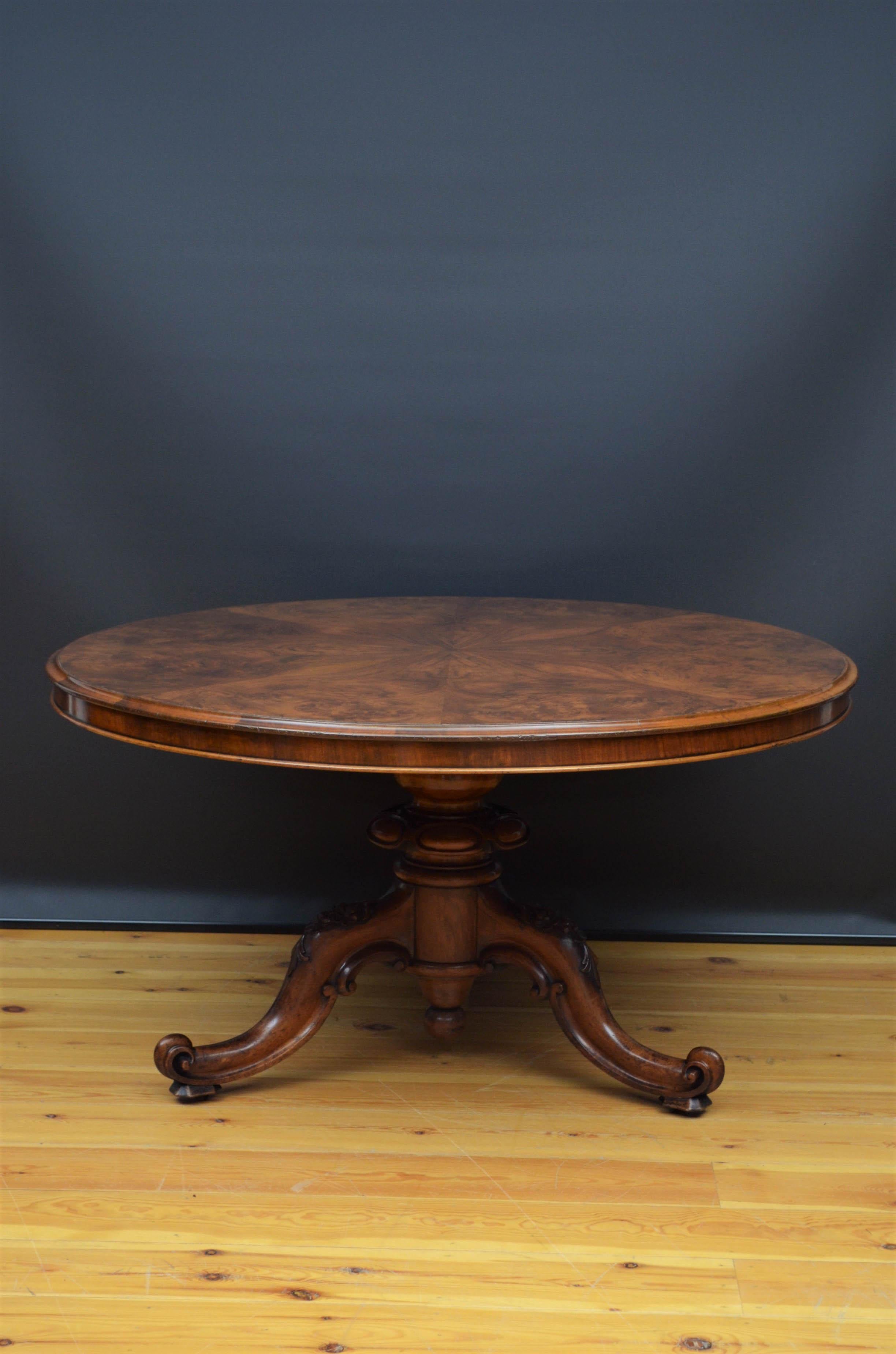 Sn5110 Superb large Victorian tilt top table, having figured walnut to with outstanding grain and moulded edge, standing on substantial turned column terminating in three carved floral carved legs and brass castors. This antique table has been