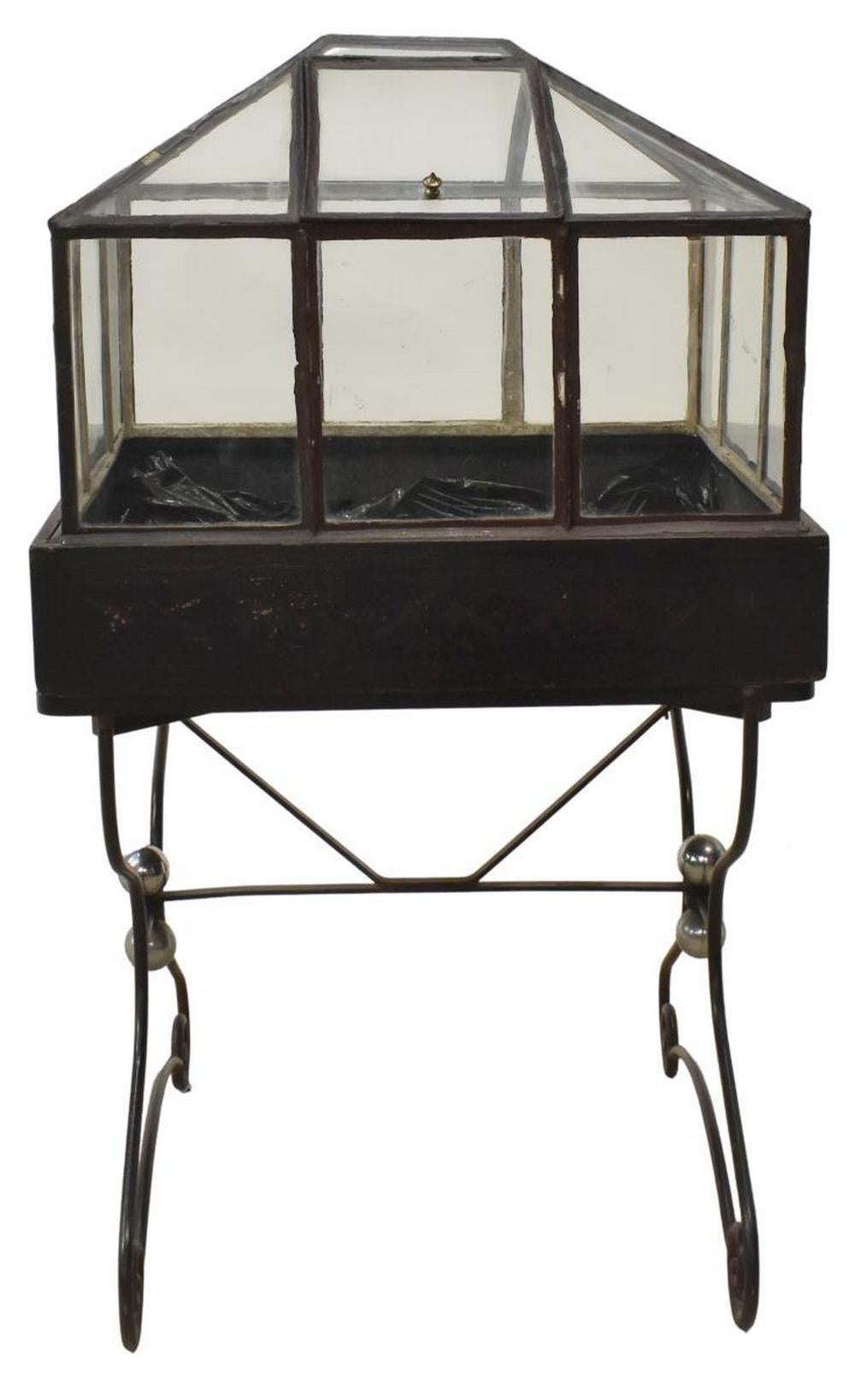Victorian Wardian case/ terrarium, glazed case with pitched roof, hinged access door, on scrolled wrought iron stand, approximately 53