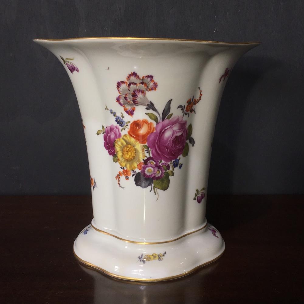 Large Vienna vase with quatrefoil lobed body and wide flared lip, well painted with large flower groups and gilt line rims.   
Blue painted shield mark, circa 1780 

